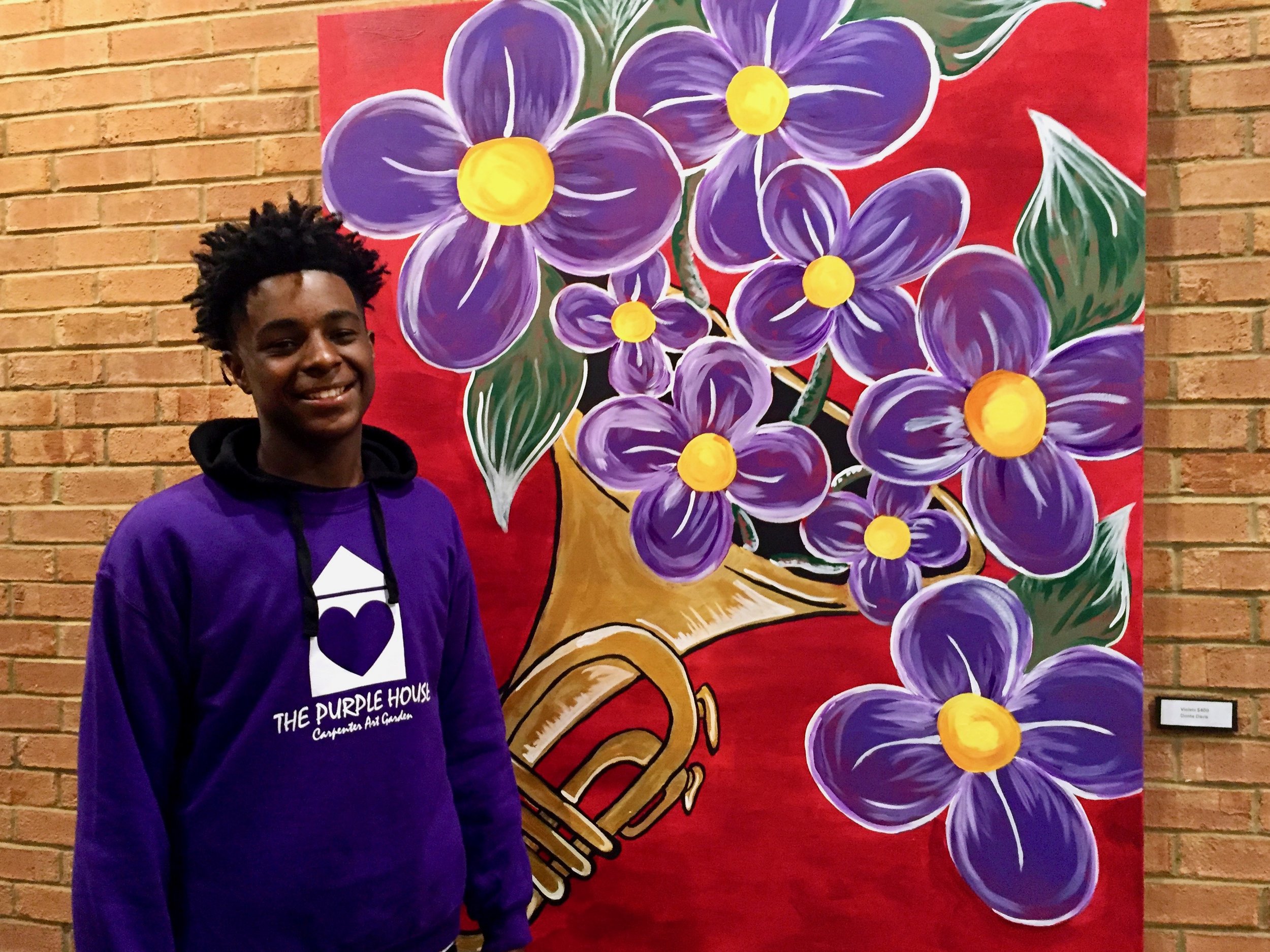 donte-staonding-in-front-of-his-painting-at-gpac 2.jpg