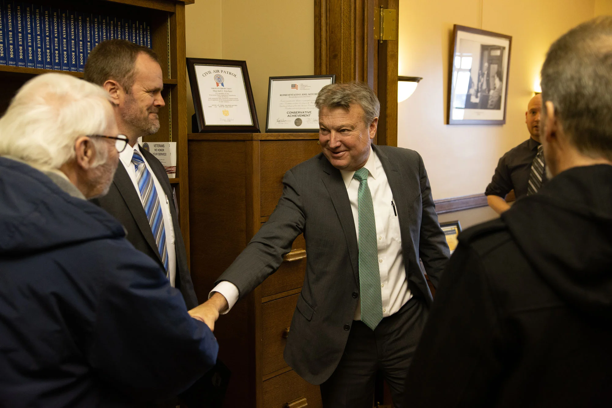 Representative Kitchens greets Hoyt Purinton, Lee Engstrom, Orion Mann and Robert Cornell