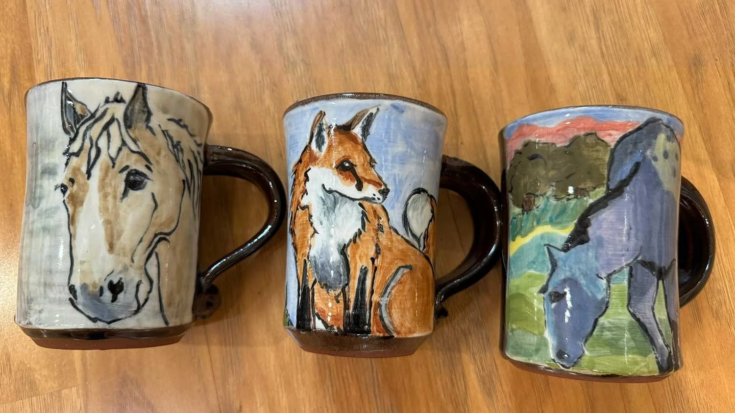 Wheel thrown, hand painted pottery by Lauren Peterson.