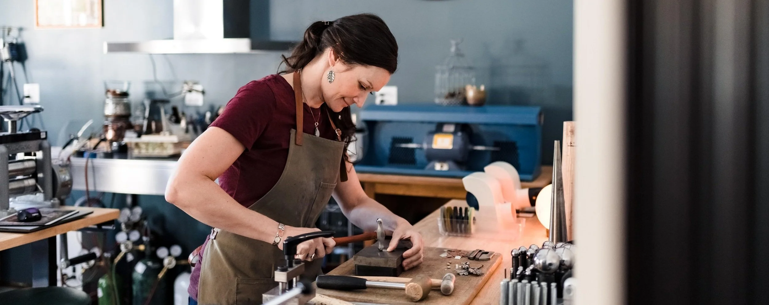Amber Wyckoff working on her jewelry.