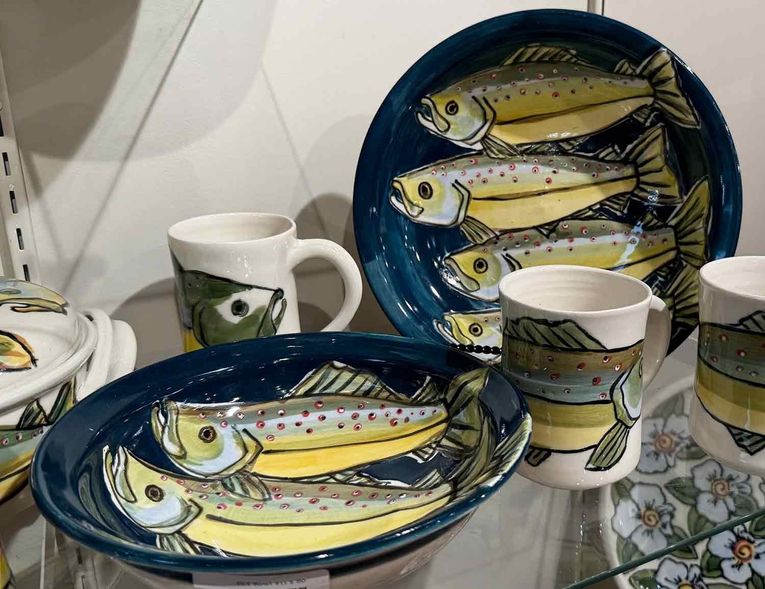 Wheel thrown, hand painted fish themed pottery by Lauren Peterson.