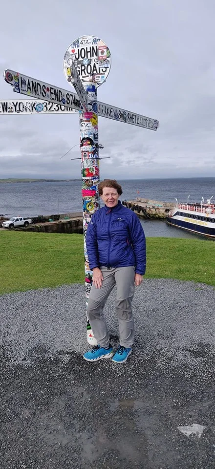 The ‘Running Granny’ at the start of her epic journey - The John o’ Groats landpost in Scotland - Photo by Joe Bowman