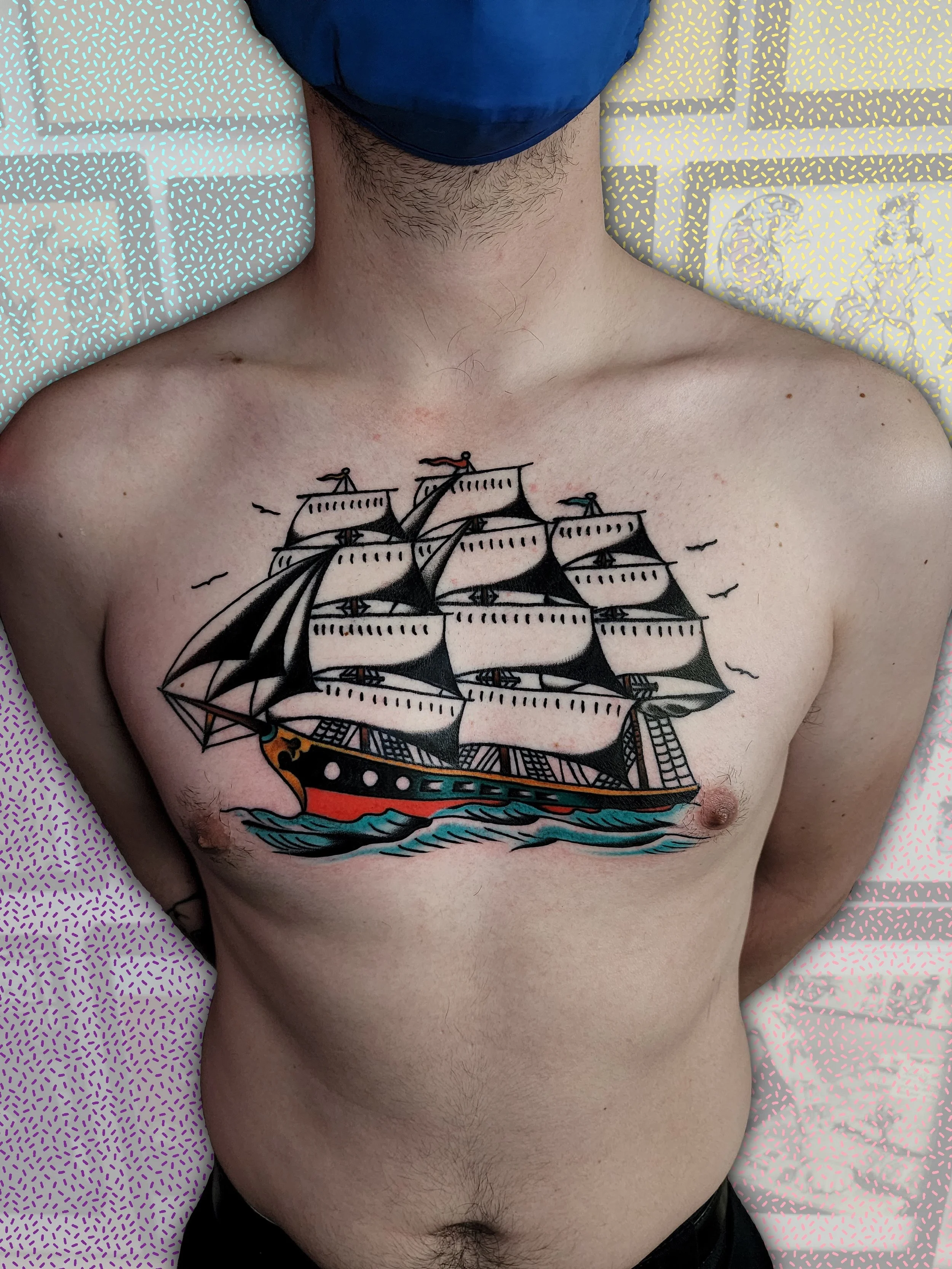  Large sailing ship with color accents, locate on chest.  