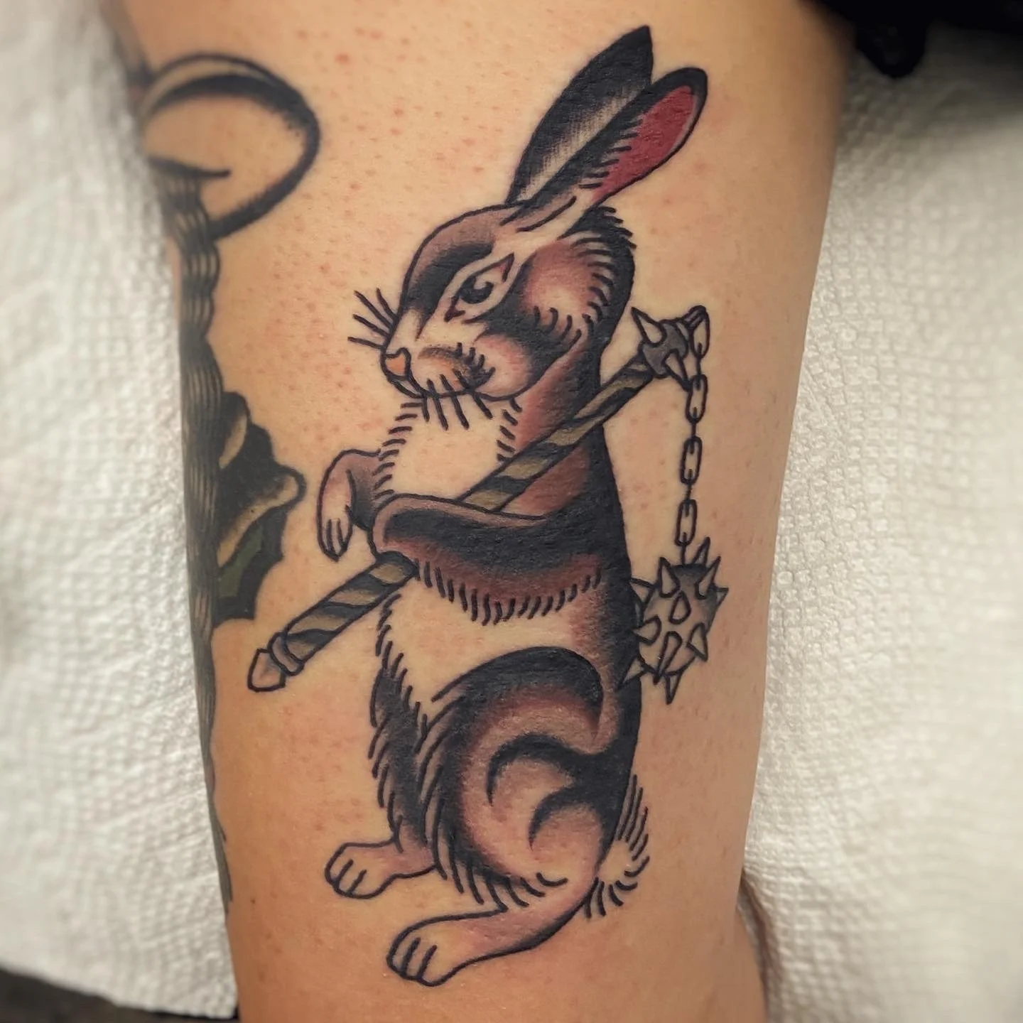 Tattoo of a bunny carrying a flail