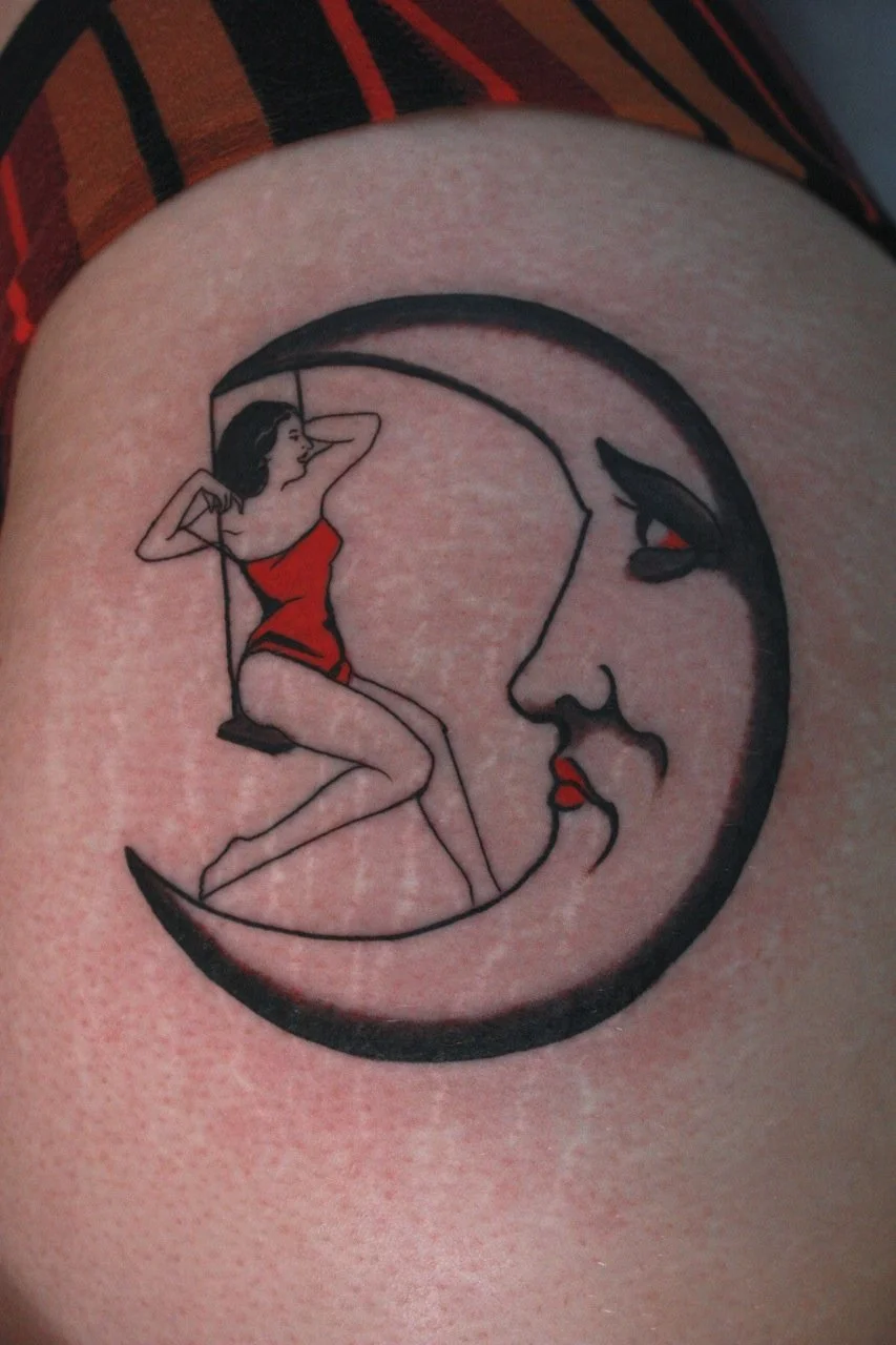 Tattoo of crescent moon with face and lady sitting on a swing hanging from the moon. 