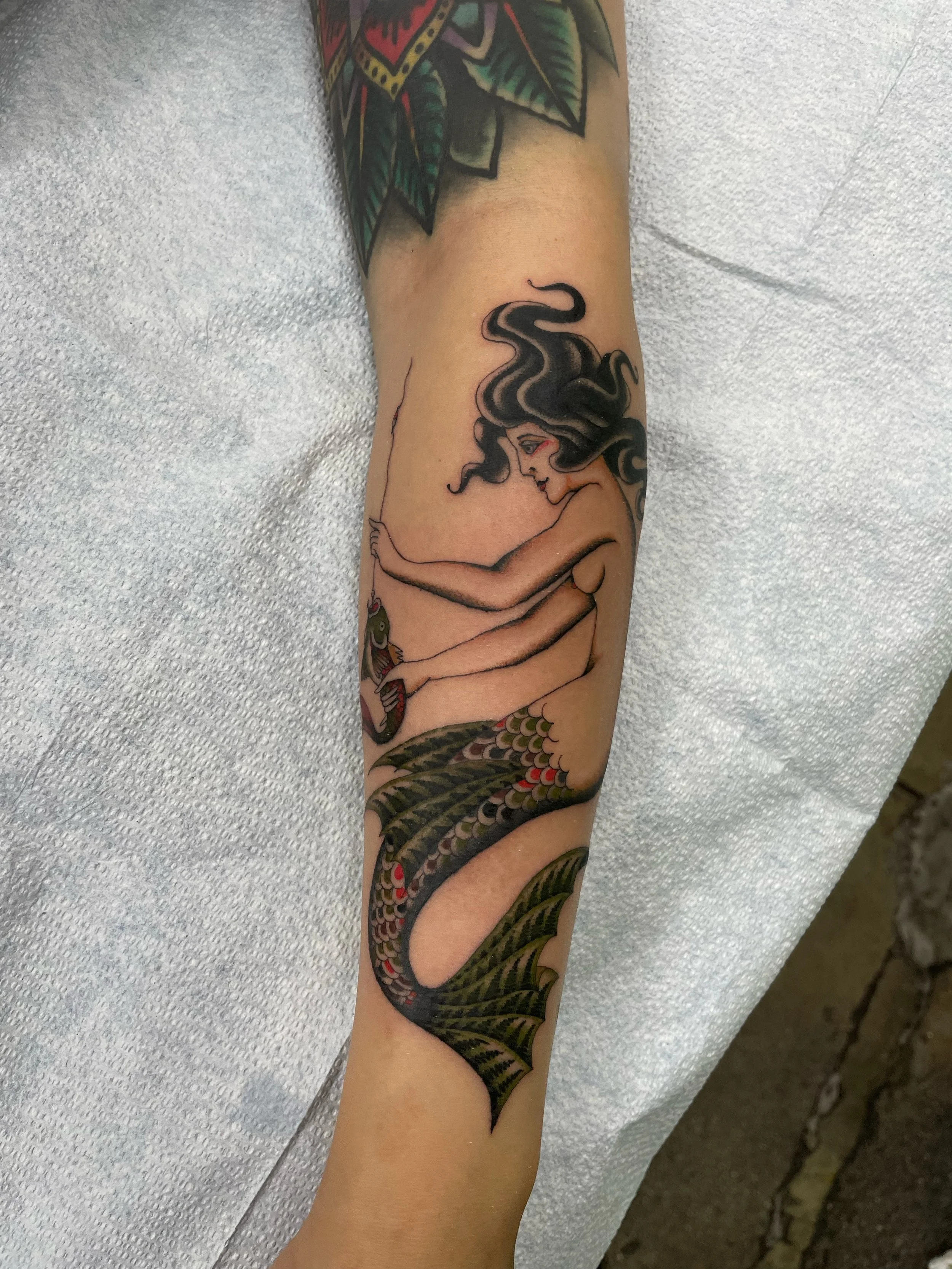 Mermaid tattoo on arm