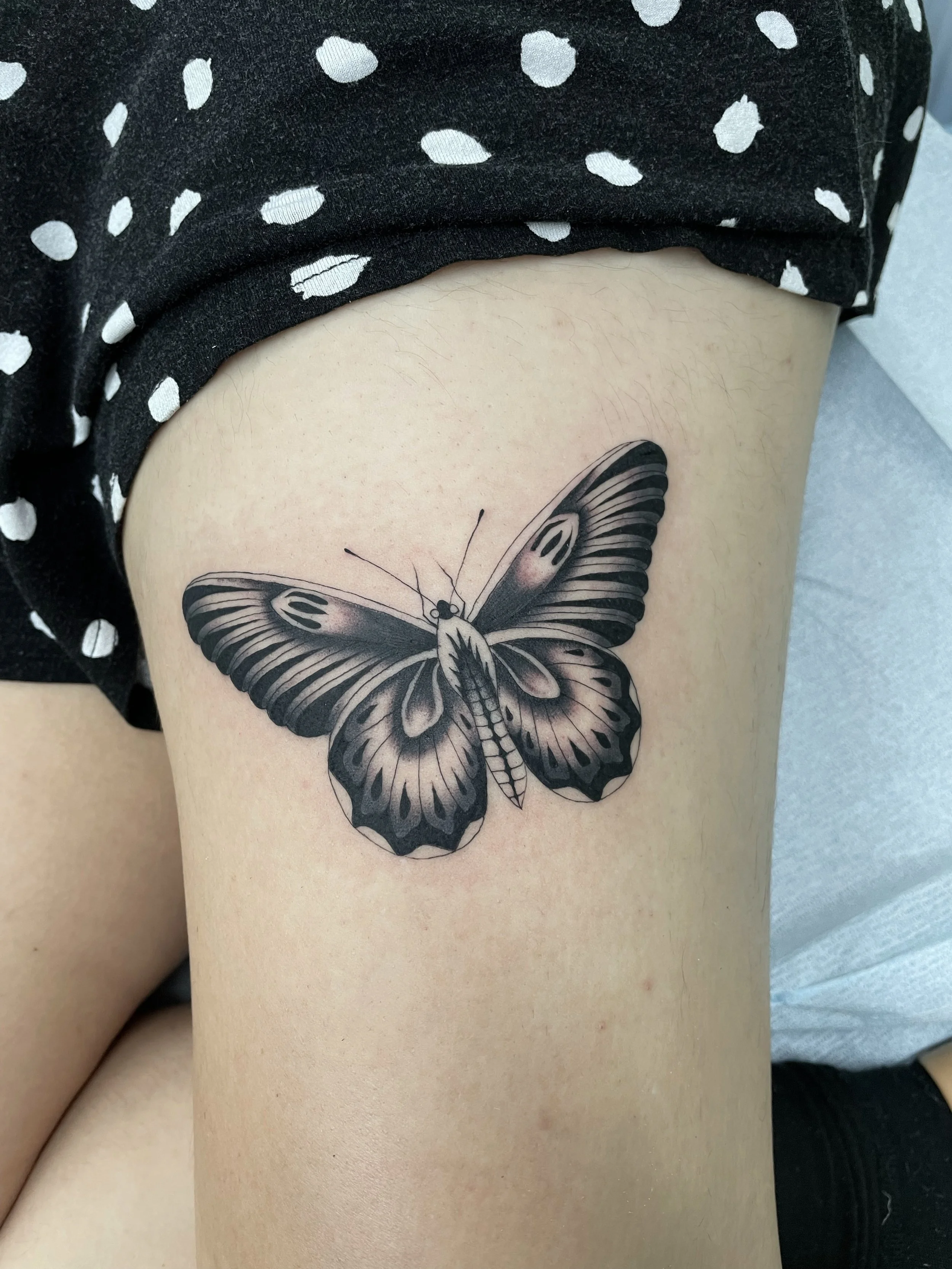 Black and grey butterfly tattoo