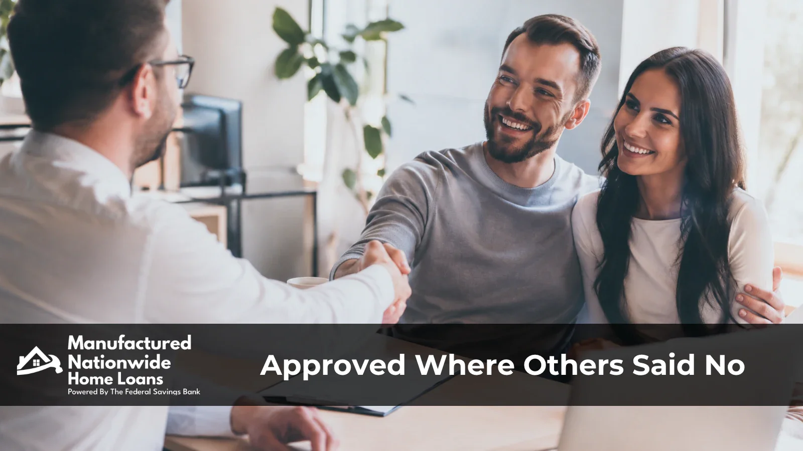 A buyer being approved by an in-house banker, representing manufactured home loan options for lower credit from ManufacturedNationwide.com.