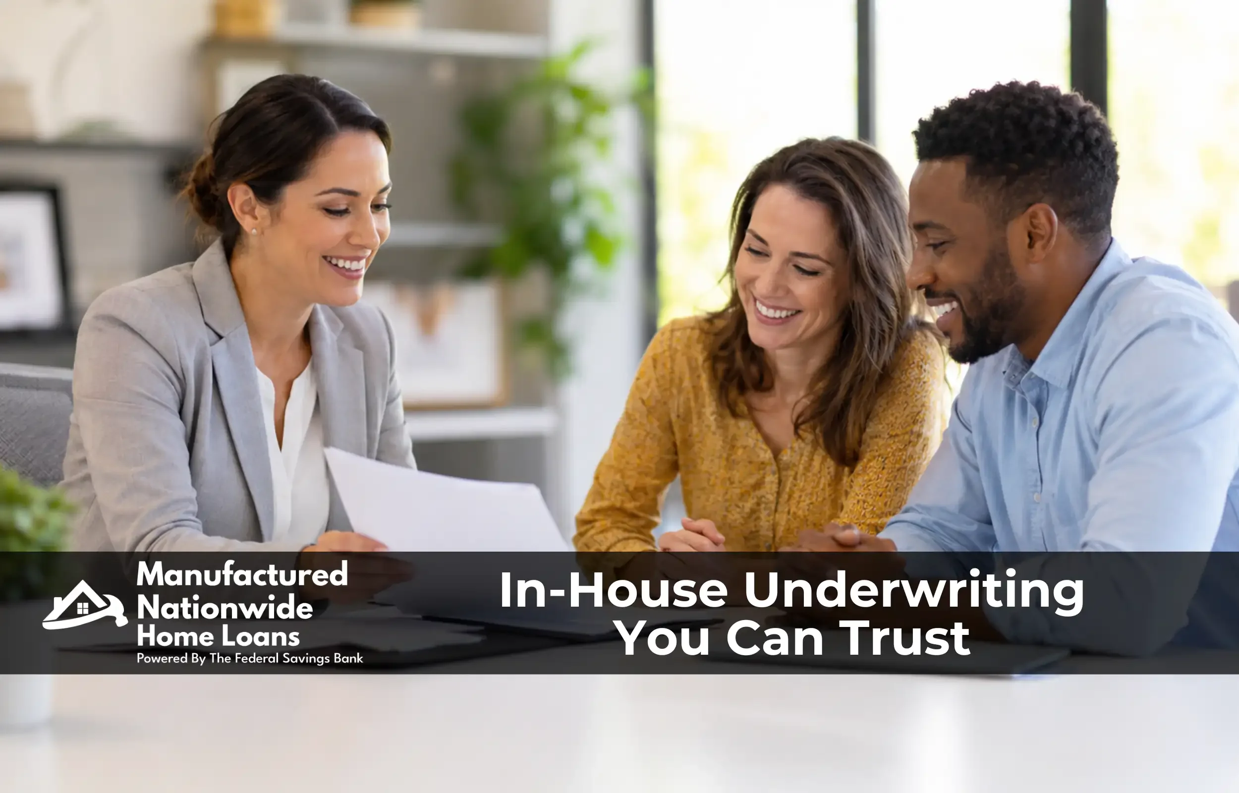A loan officer reviewing loan options in person with a homeowner couple, representing the in-house underwriting team at ManufacturedNationwide.com