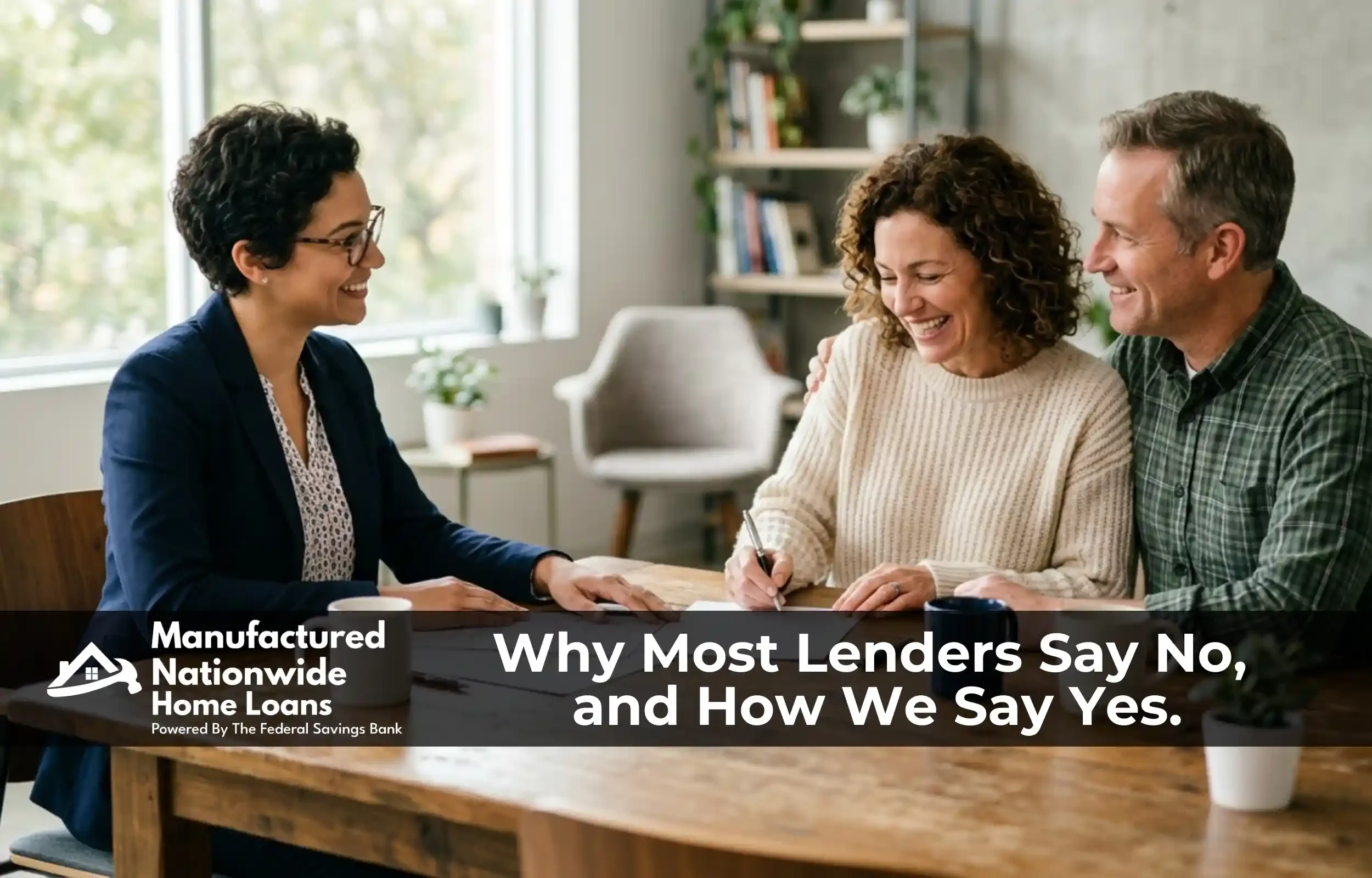 A loan officer reviewing manufactured home equity options in person with a homeowner couple, representing the in-house, by-exception approach of BuildBuyRefi.com.