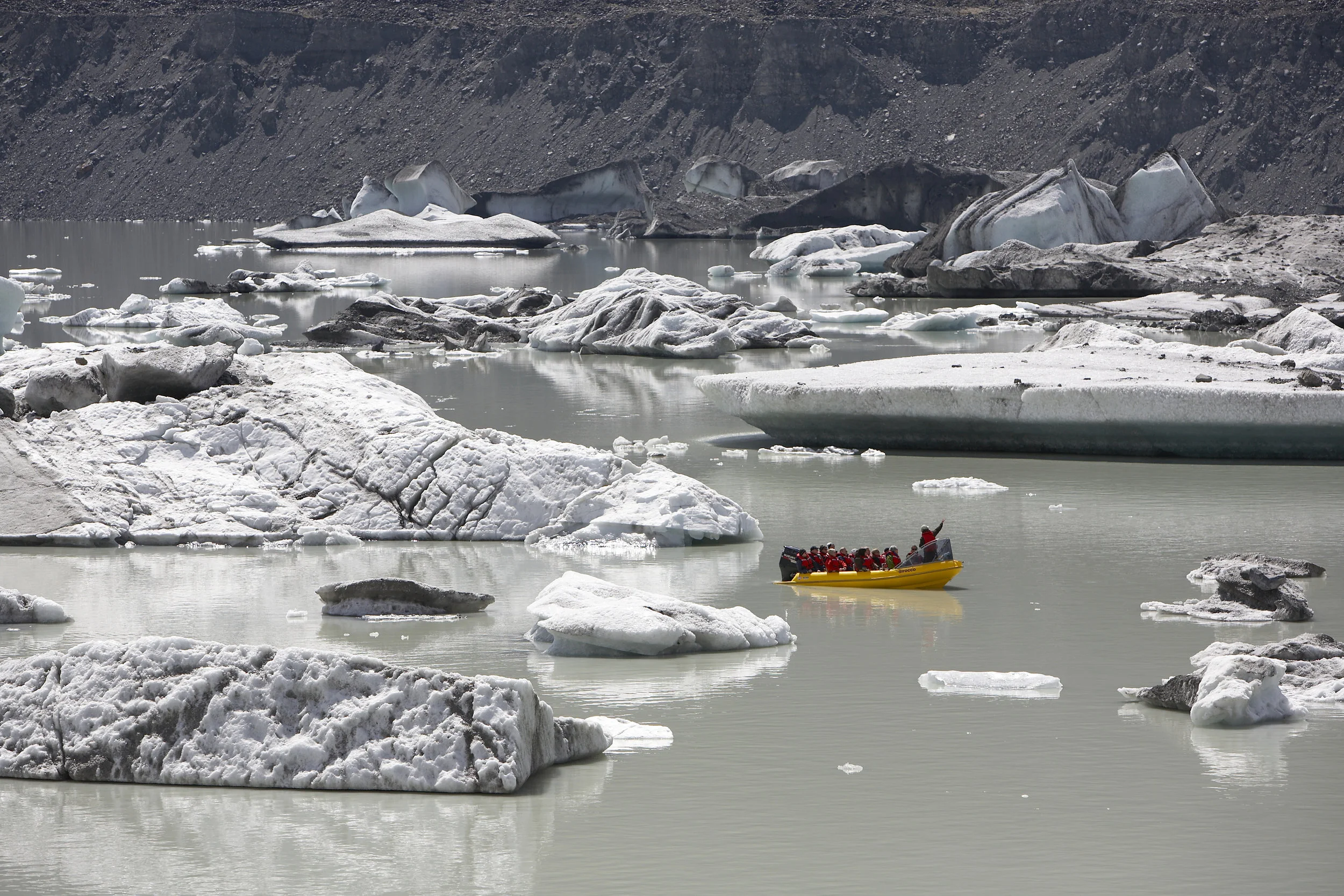 Kayak on an ice lake at Tasman Glacier, middle of the South Island