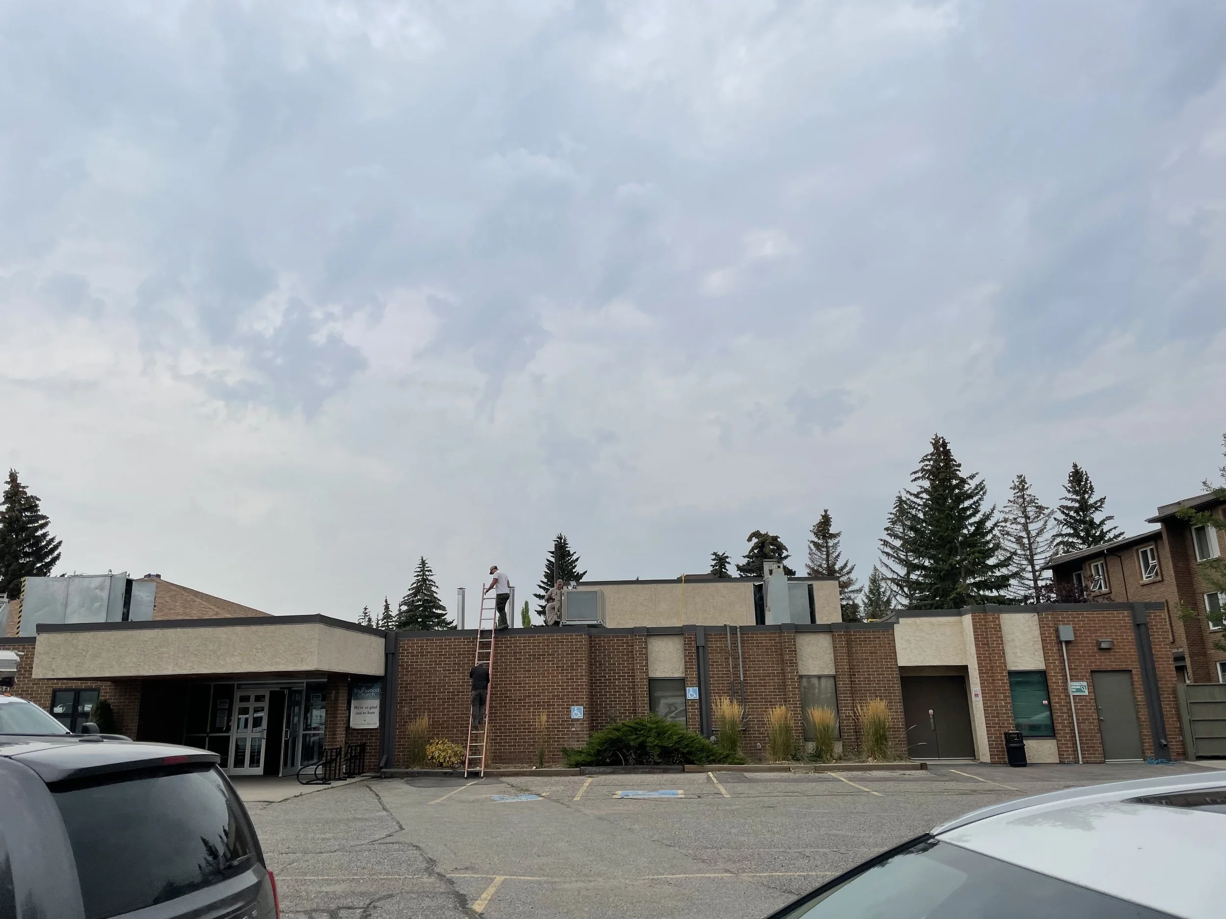 SWUC Ascending the Ladder to install RTUs.jpeg