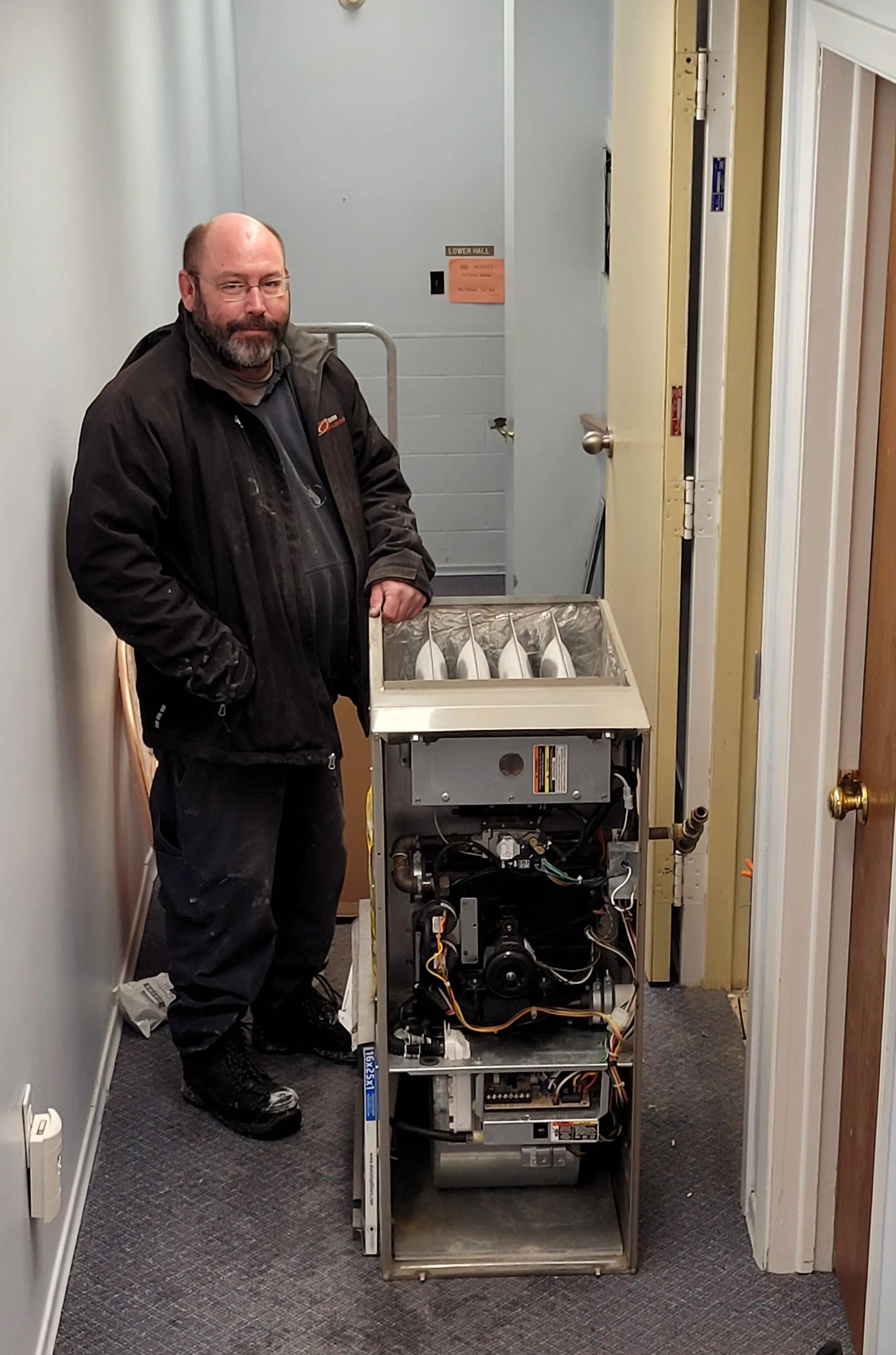 Dow Climate worker installing heat pump.jpg