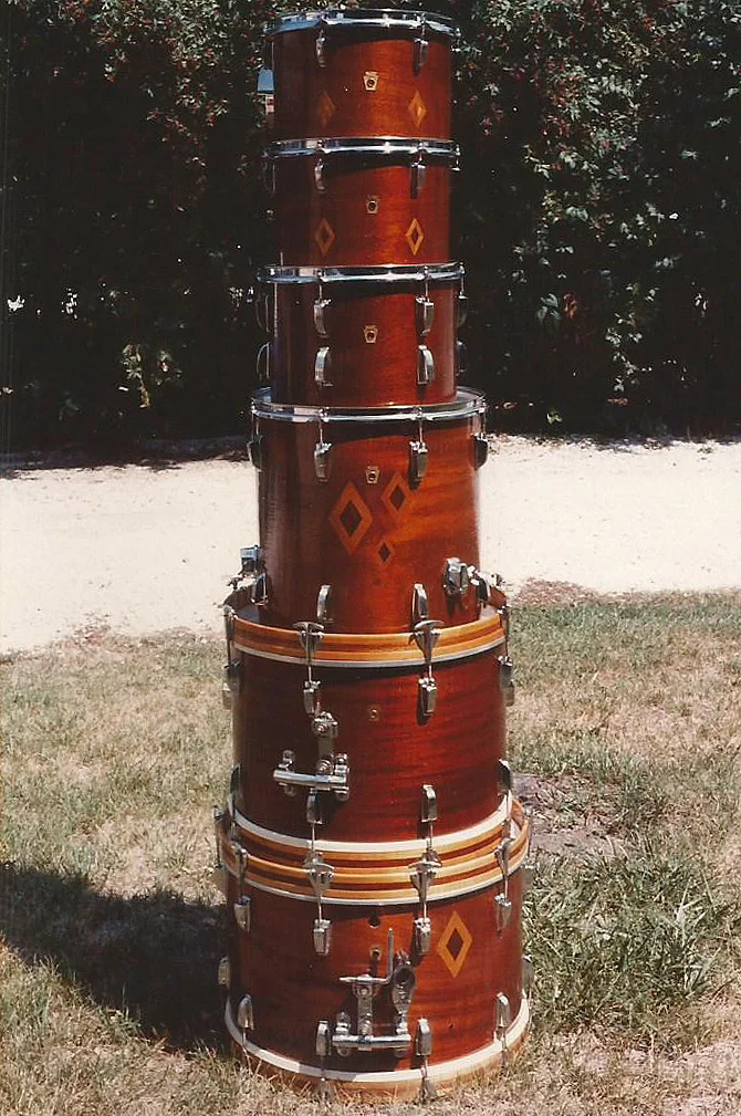Pre Serial to 1967 Ludwig Drums. Formerly Red Sparkle pearl, Sky Blue Pearl, and White pearl, Wrap removed to match and Oak & Mahogany inlay executed in the mid 1970's while touring.