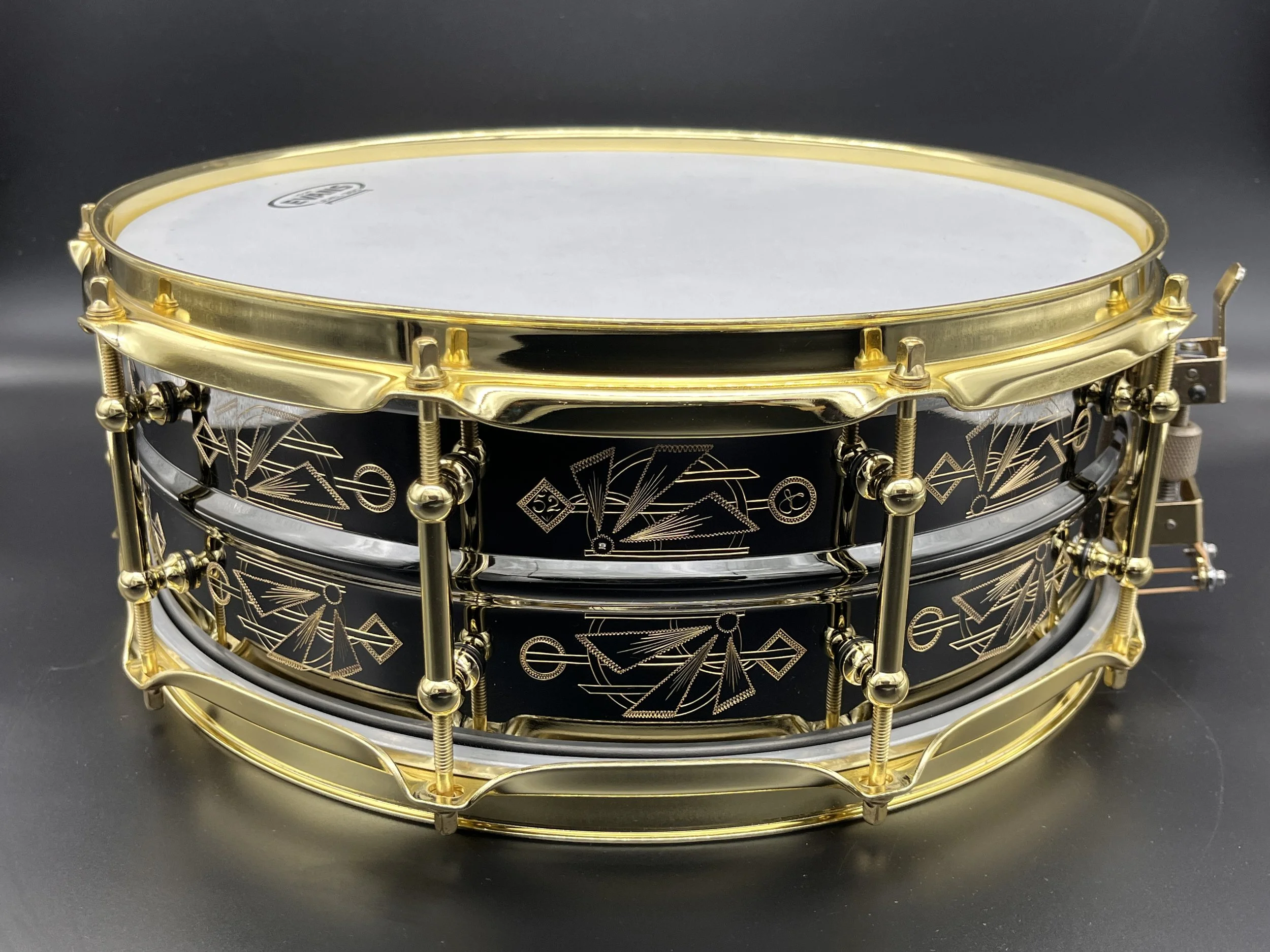 Black over brass Deco pattern