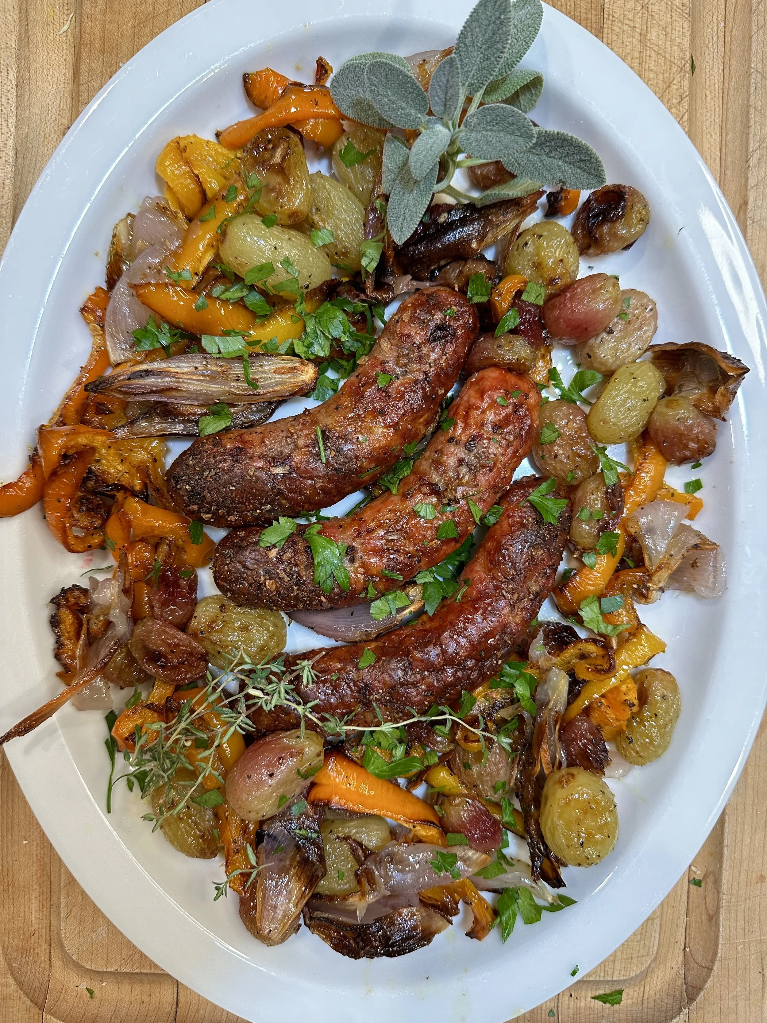 Sheet-Pan Sausages with Shallots, Peppers, and Grapes