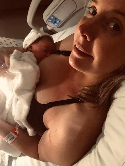 Ash and baby Harriet in their post birth love bubble