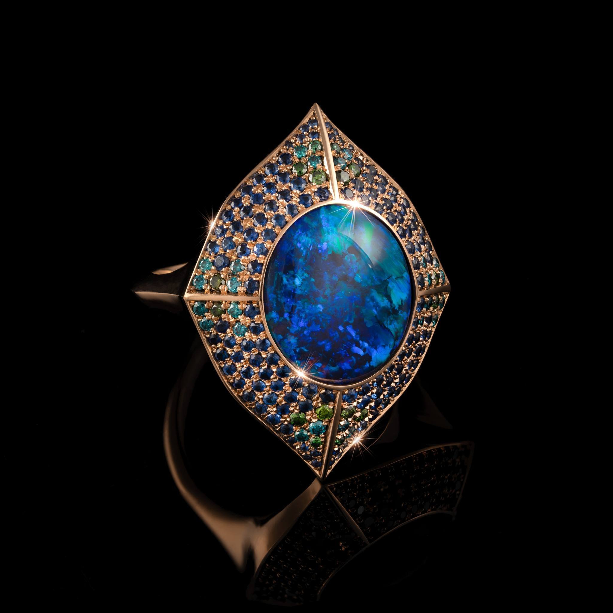 Inspired by the music of the one and only David Bowie, Nigel O'Reilly's Cat's Eye Nebula is a cosmic wonder. The centre stone is a Lightning Ridge opal. Formed over millions of years through a rare process where silica-rich water solidifies in ancien