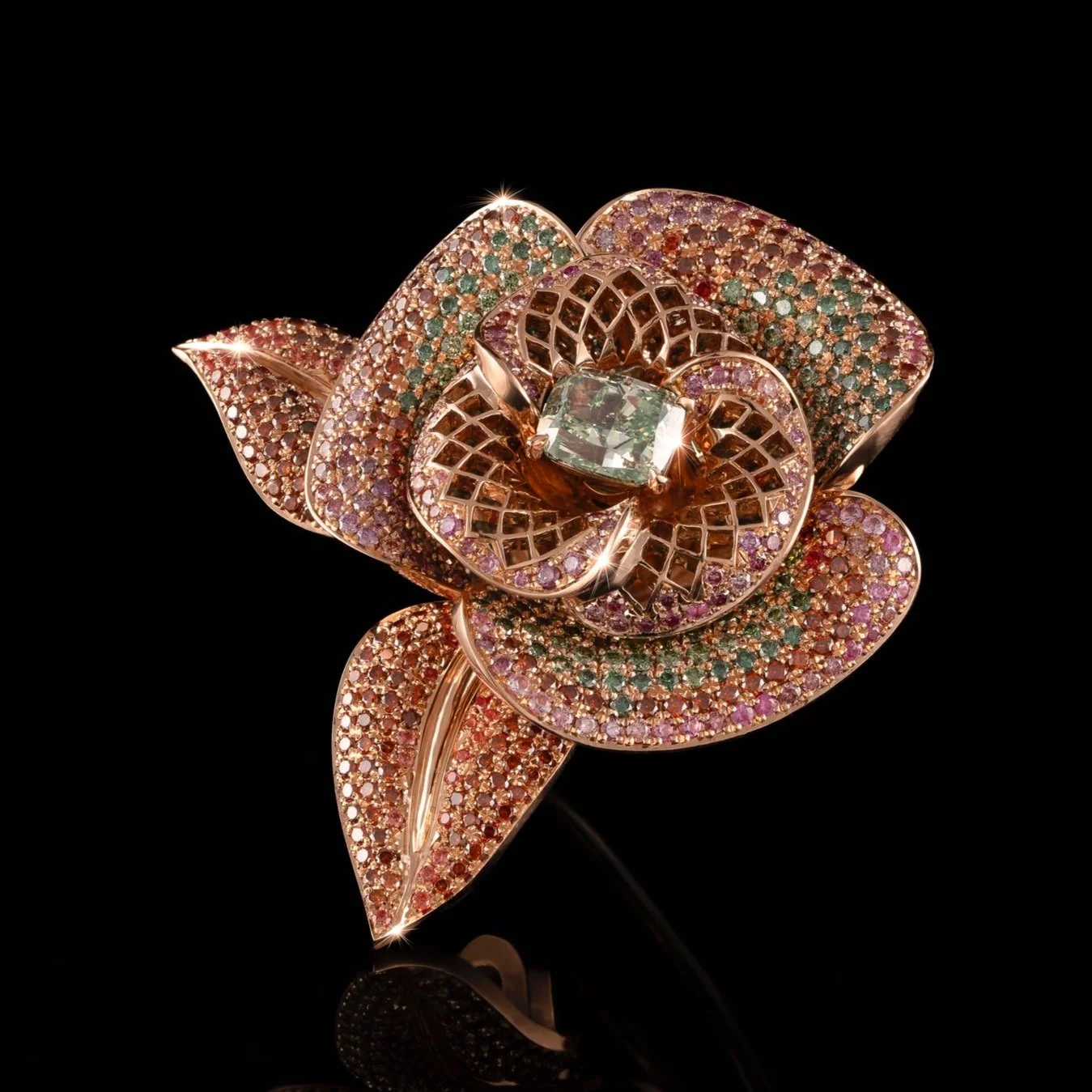18kt rose shaped brooch with central green diamond by high-jewellery designer Nigel O'Reilly, based in the west of Ireland