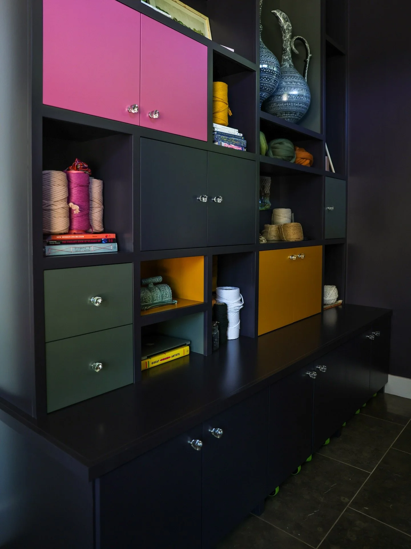 A colorful weaving studio with an array of storage solutions in Toledo, Ohio.
And a good dog.