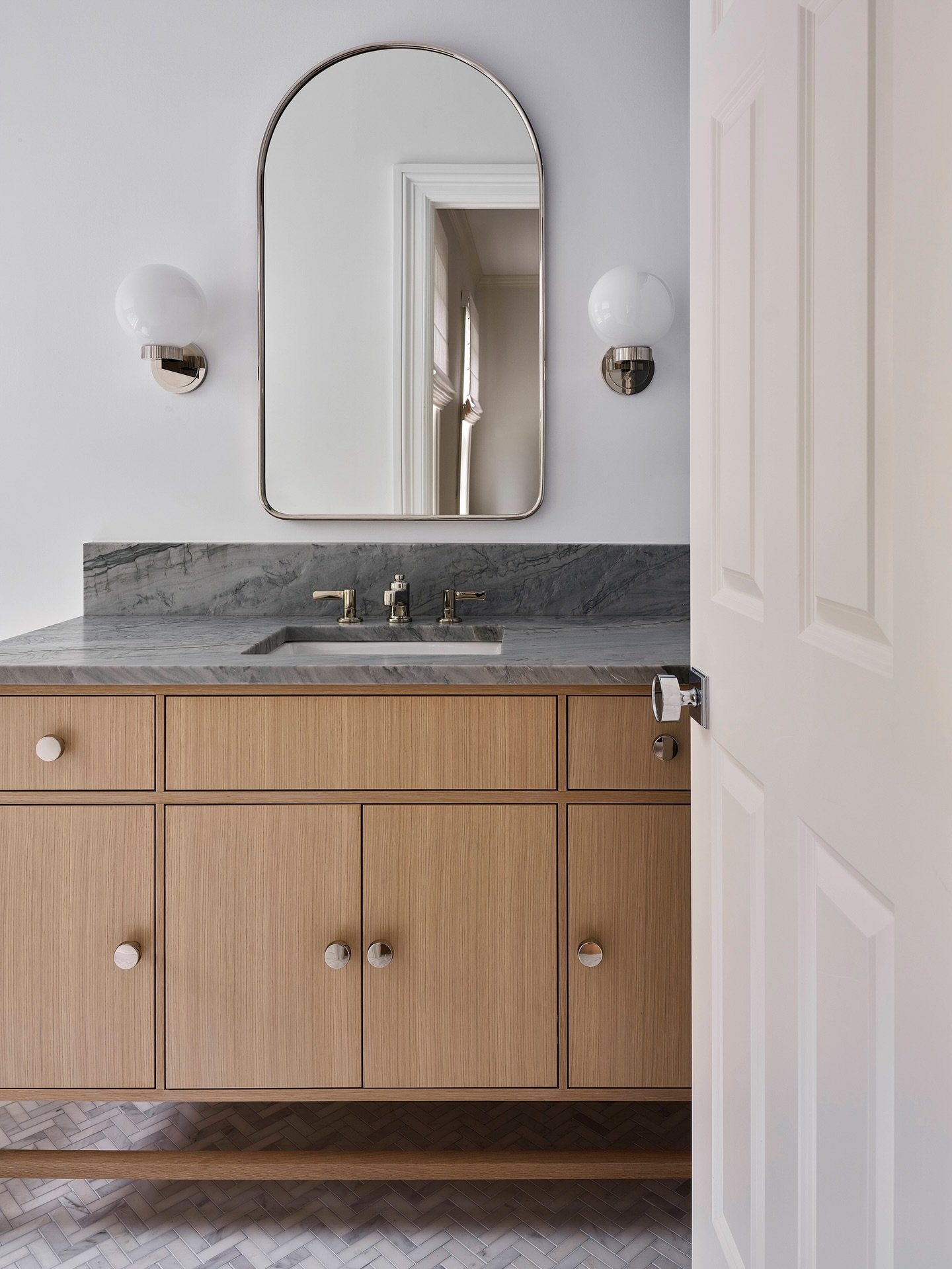 Designing for multiple baths in one home is a unique challenge. We attempt to create a shared style and cohesiveness while giving each room its own personality through materials, lighting, and fixtures. Our Wilton project features 5 renovated baths -