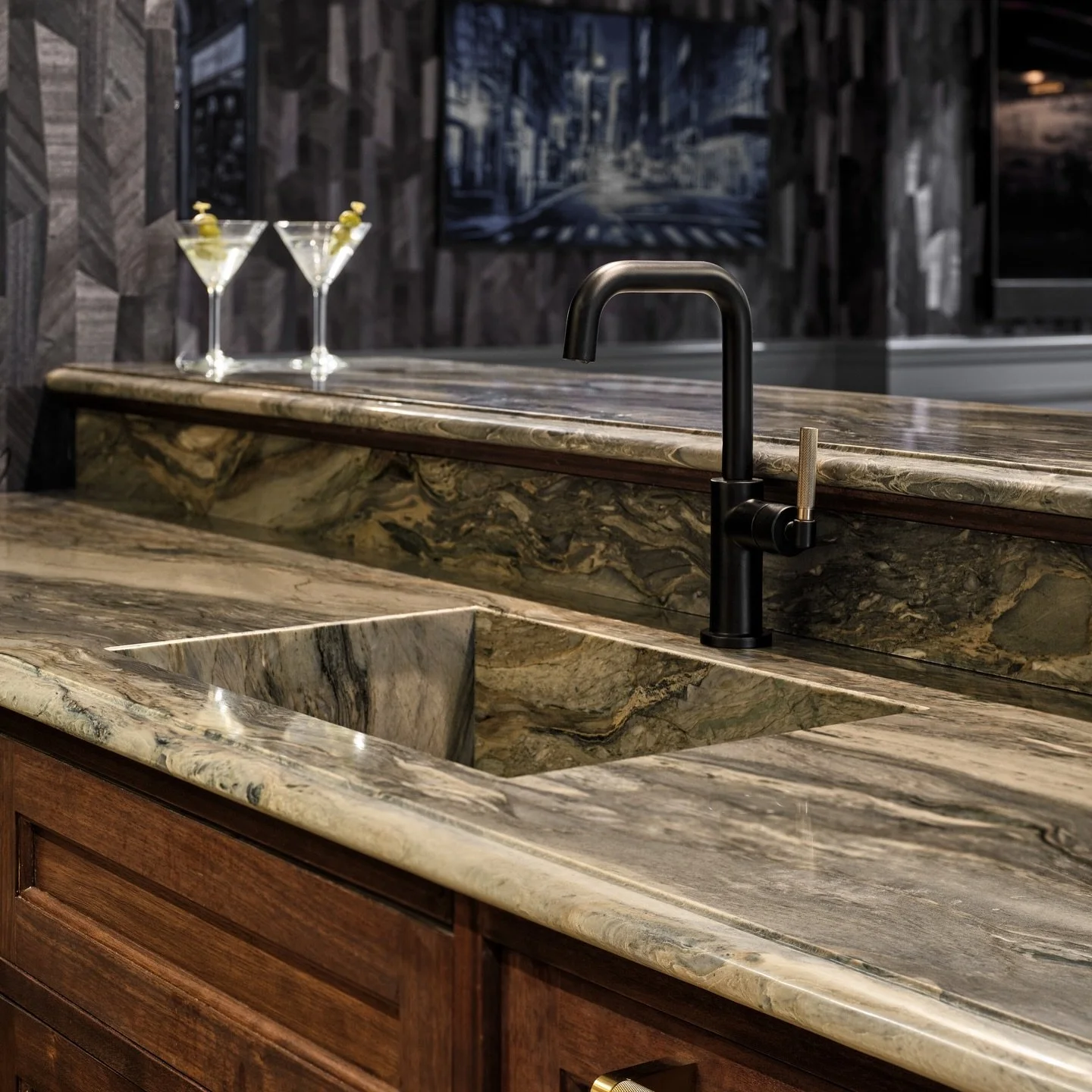An integrated stone sink within the countertop is one of a few special details in our Scarsdale cellar bar project