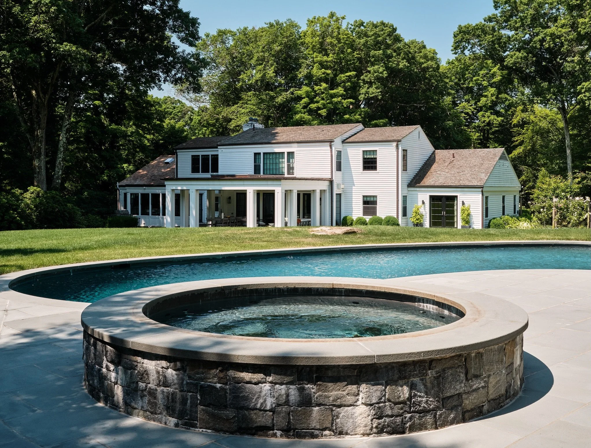 Pool, pool deck, and spa renovation in Greenwich with a new screened terrace addition