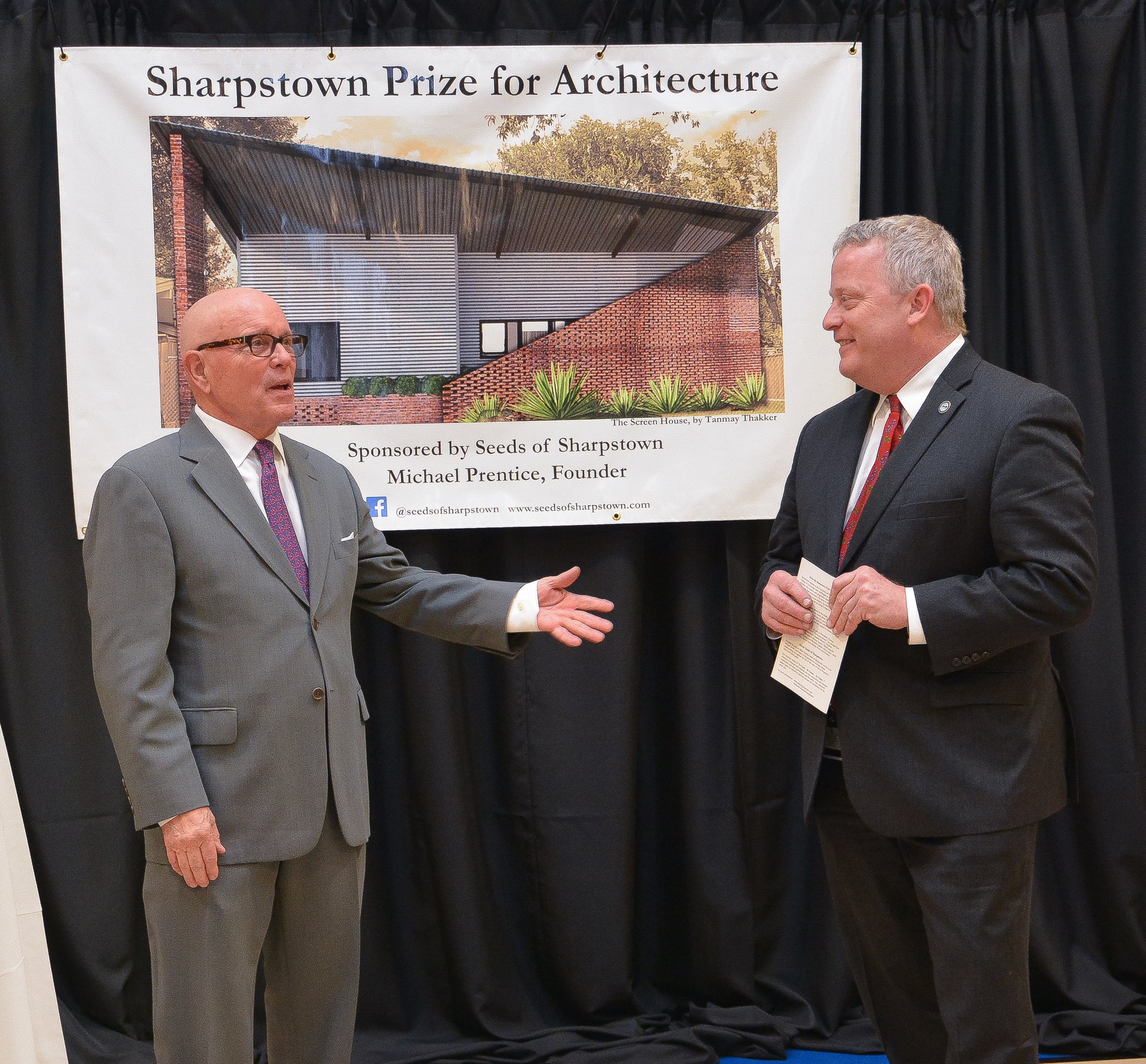 Michael Prentice is joined by Houston City Councilman David Robinson during remarks at the Sharpstown Prize for Architecture exhibition.