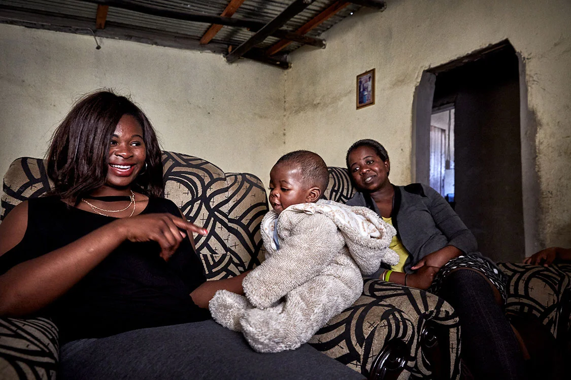 Black Mambas Leitah & Goodness with Qolile’s son Renold at home