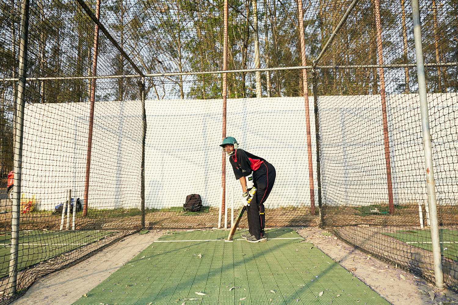 Dalida waits for her next ball during batting practice