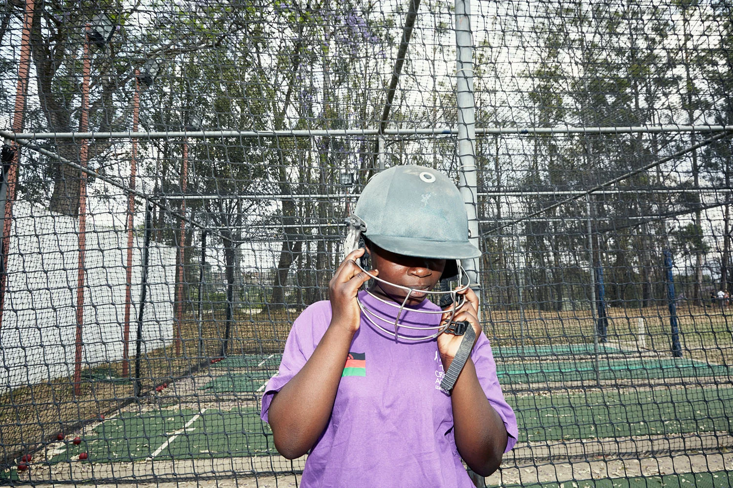 Mary adjusts her helmet