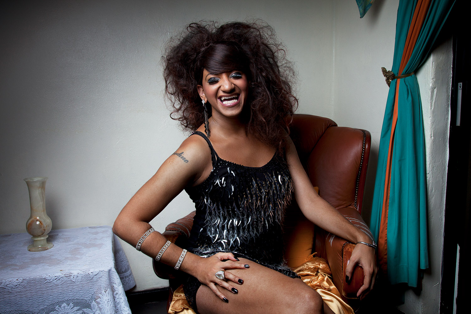  Chedino, backstage, during a Divas in Cabaret performance, Elsies River, Cape Town, 2012.  Divas in Cabaret was a lip-sync group formed by Chedino and which consisted of LGBTQ community members. The group performed covers of songs by Whitney Houston