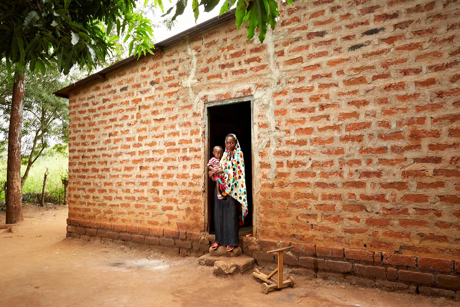 Baraka with his mother Zena at home
