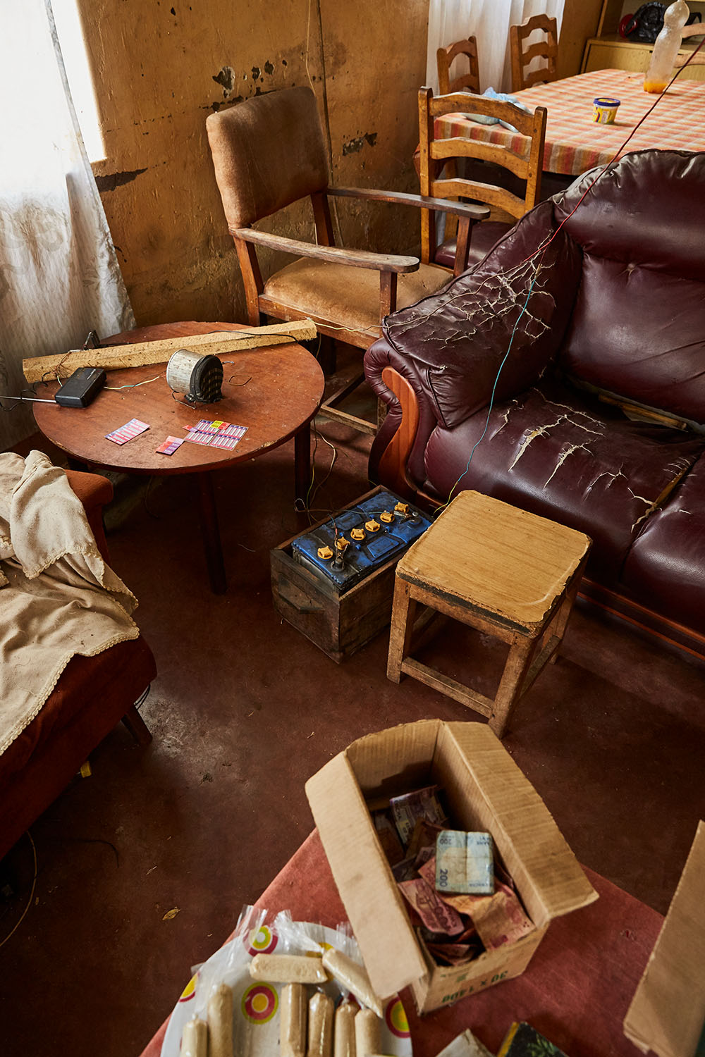  The living room of Felix Wonga’s home, Luchenza, Malawi, 2017.  The solar panels that Felix uses for his mobile phone charging business also powers their lights, and several small radio’s and speakers. Felix: “We are the only ones in this area that 