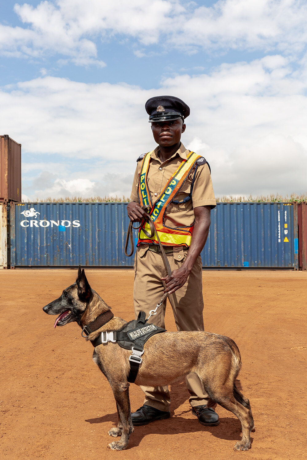  Wildlife Detection Dog Unit handler Benjamin with dog Nikita, Bridge Shipping, Lilongwe, Malawi, 2020. 
