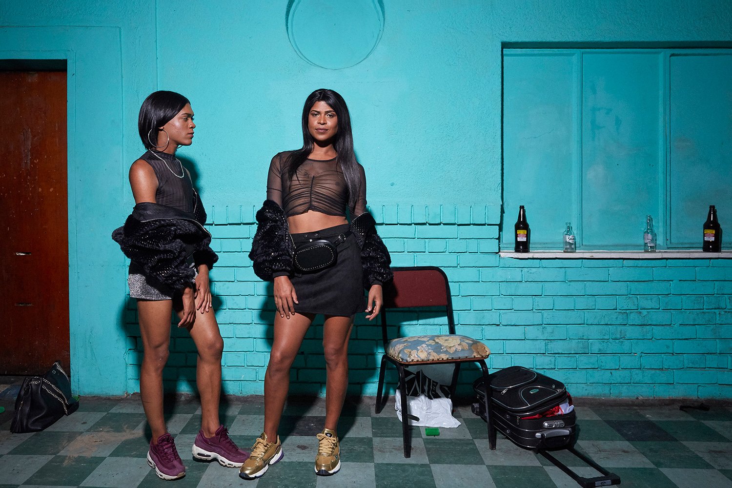  Two backstage assistants pose for the camera at the 2019 Miss Calendar Girl beauty pageant, Retreat Hotel, Cape Town, South Africa. 