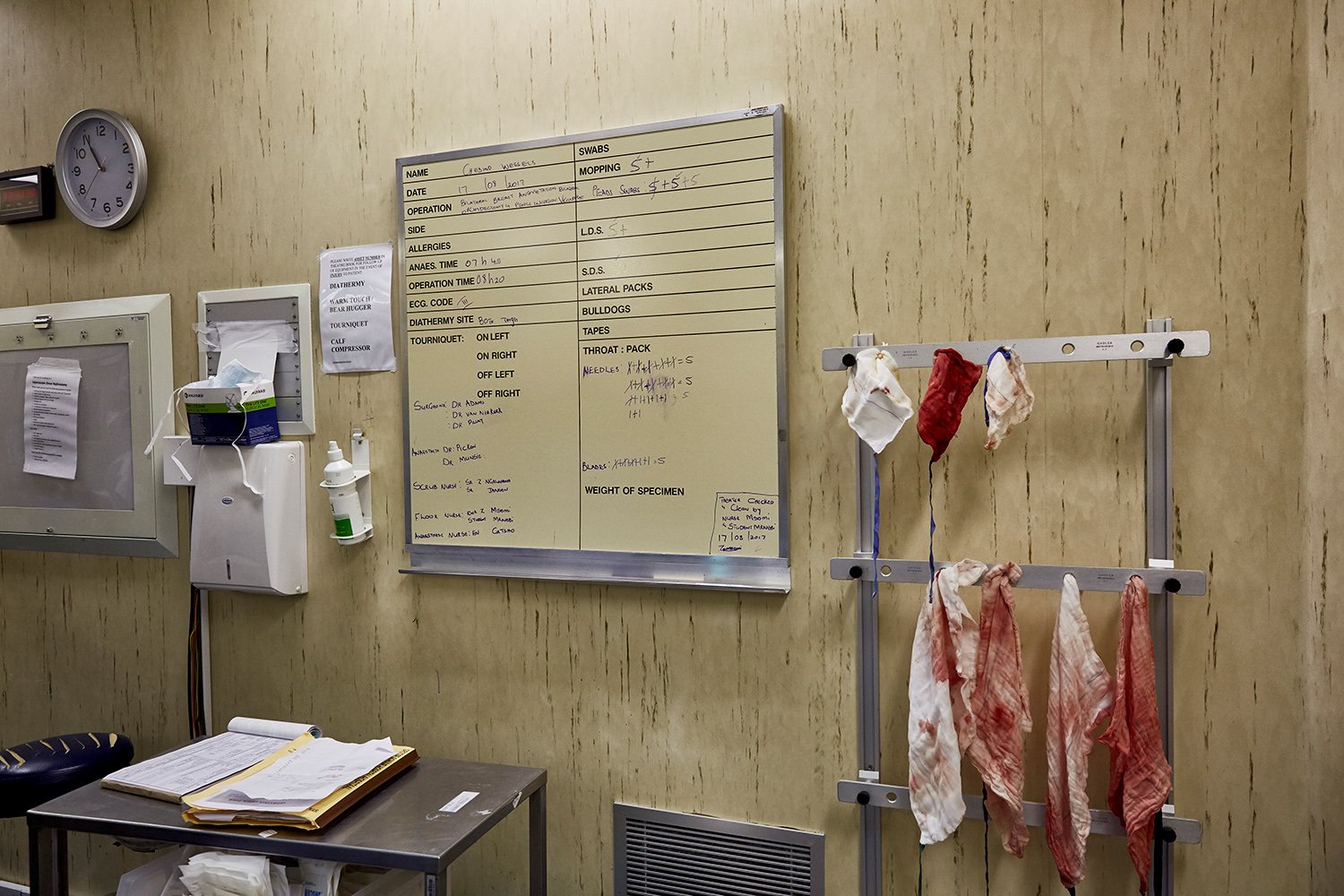 The surgical information board lists the procedures that were carried out on Chedino during her gender-affirming surgery, Groote Schuur Hospital, Cape Town, 2017.   The bloody bandages were hung up and counted to make sure none are left inside the p
