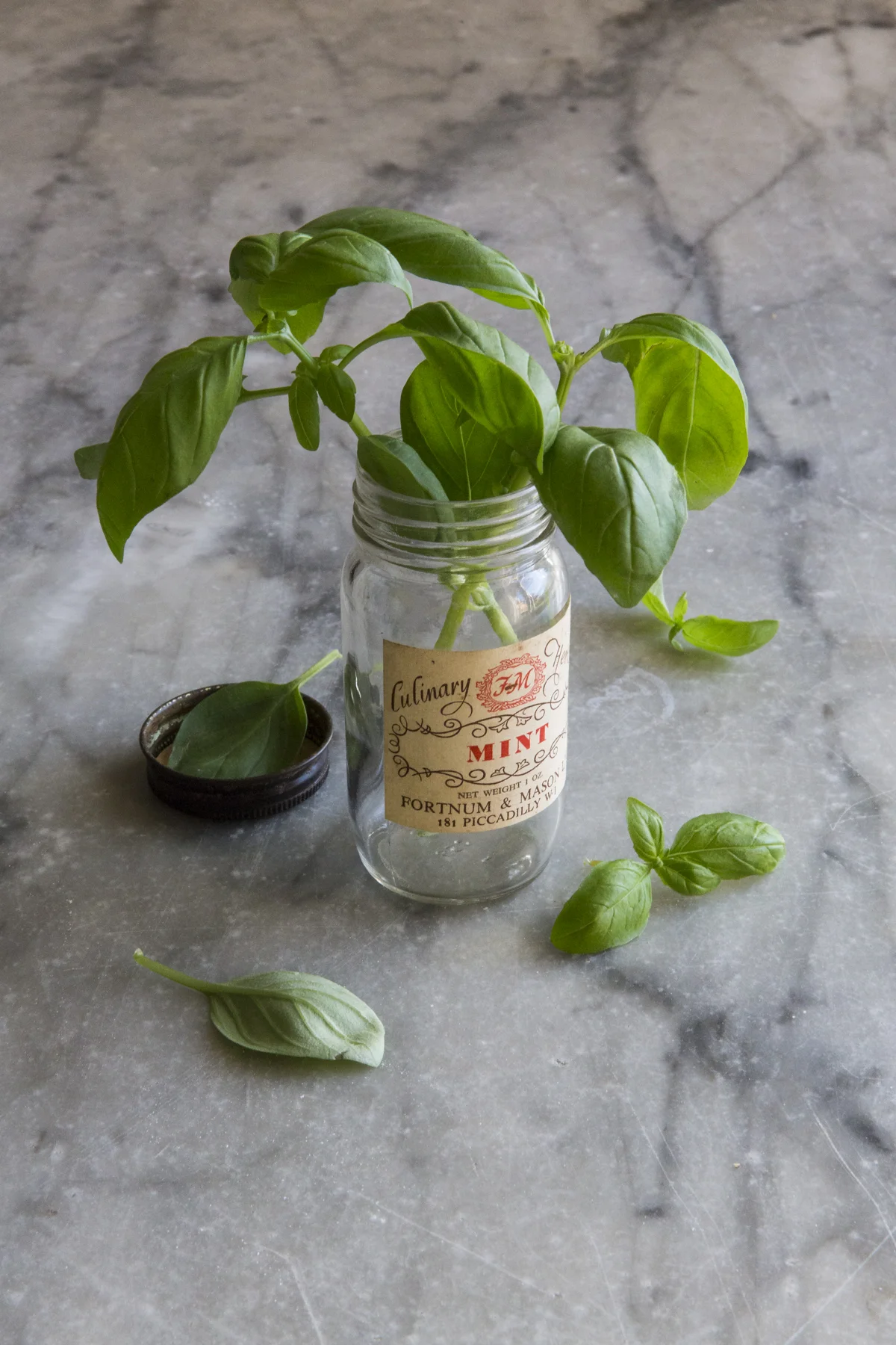 F22 Focus is on the jar label, pretty much everything is in focus, the basil in the lid, behind and above are all pretty sharp. Note the details of the marble it’s all in focus and fighting with the subject.