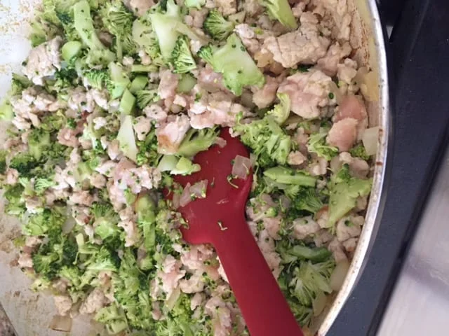 Cook the broccoli, onions, and meat till almost all pink is gone.