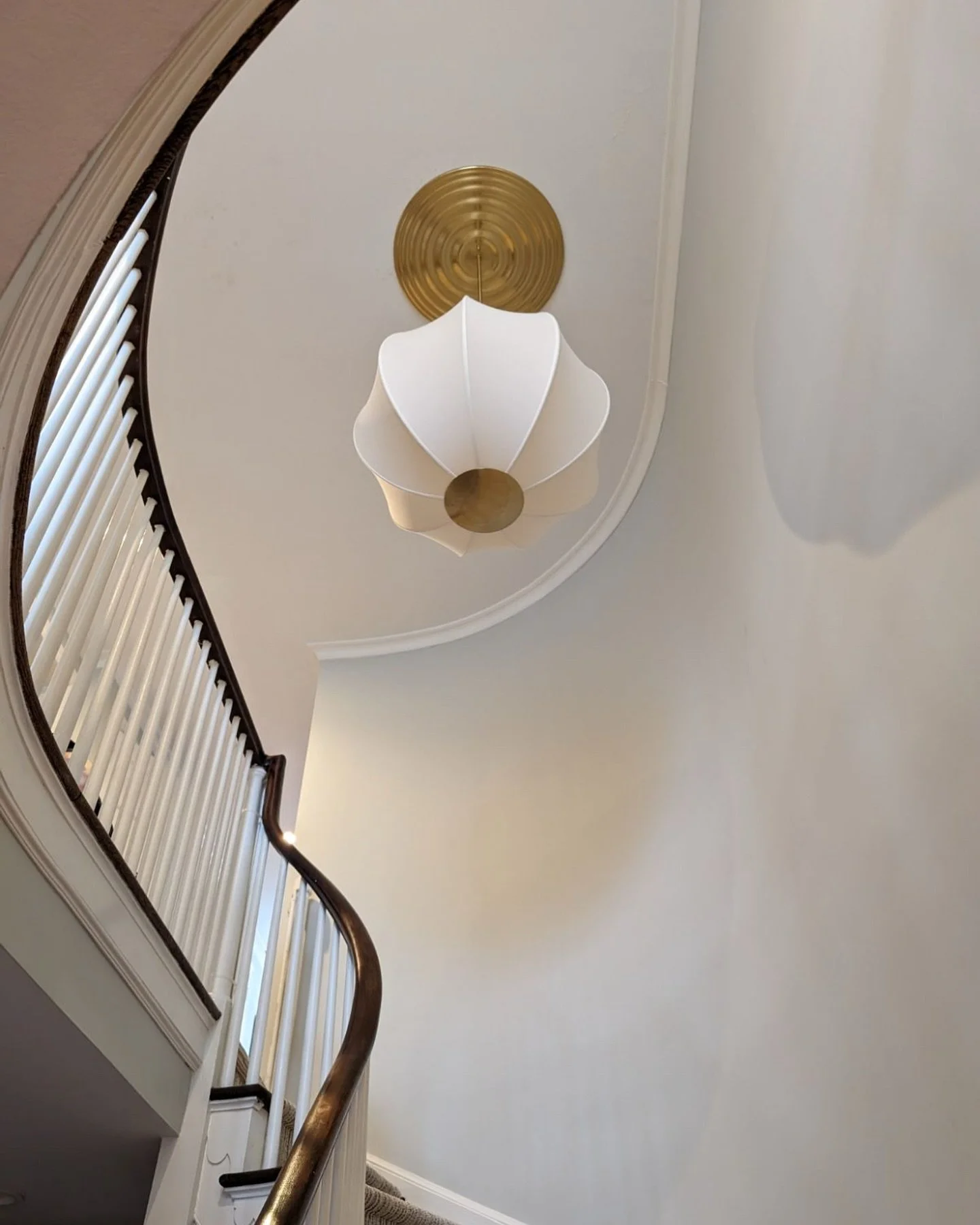 an amazing installation of the jupiter pendant from @hudsonvalleylighting by @dariabdesigns π€ the large ringed canopy adds a unique design element to this pendant, making it the perfect statement for this stairway