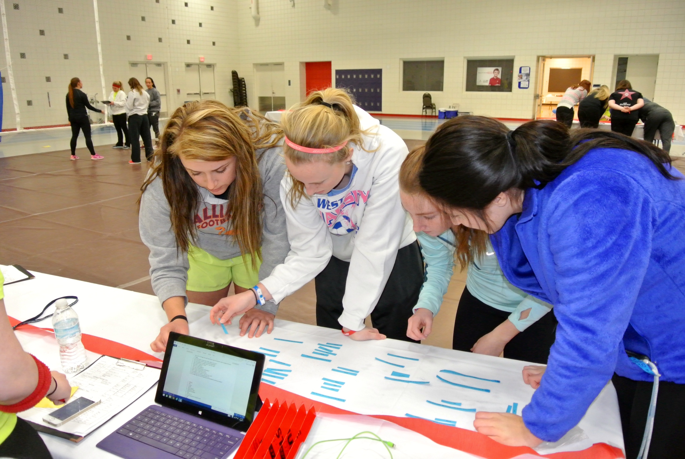 Students-Mckenzie-Gohn-Shannon-Brown-Savannah-King-and-Haley-Rusicka-compete-a-St.-Jude-trivia-challenge-at-the-Up----til-Dawn-event-3-2015.jpeg