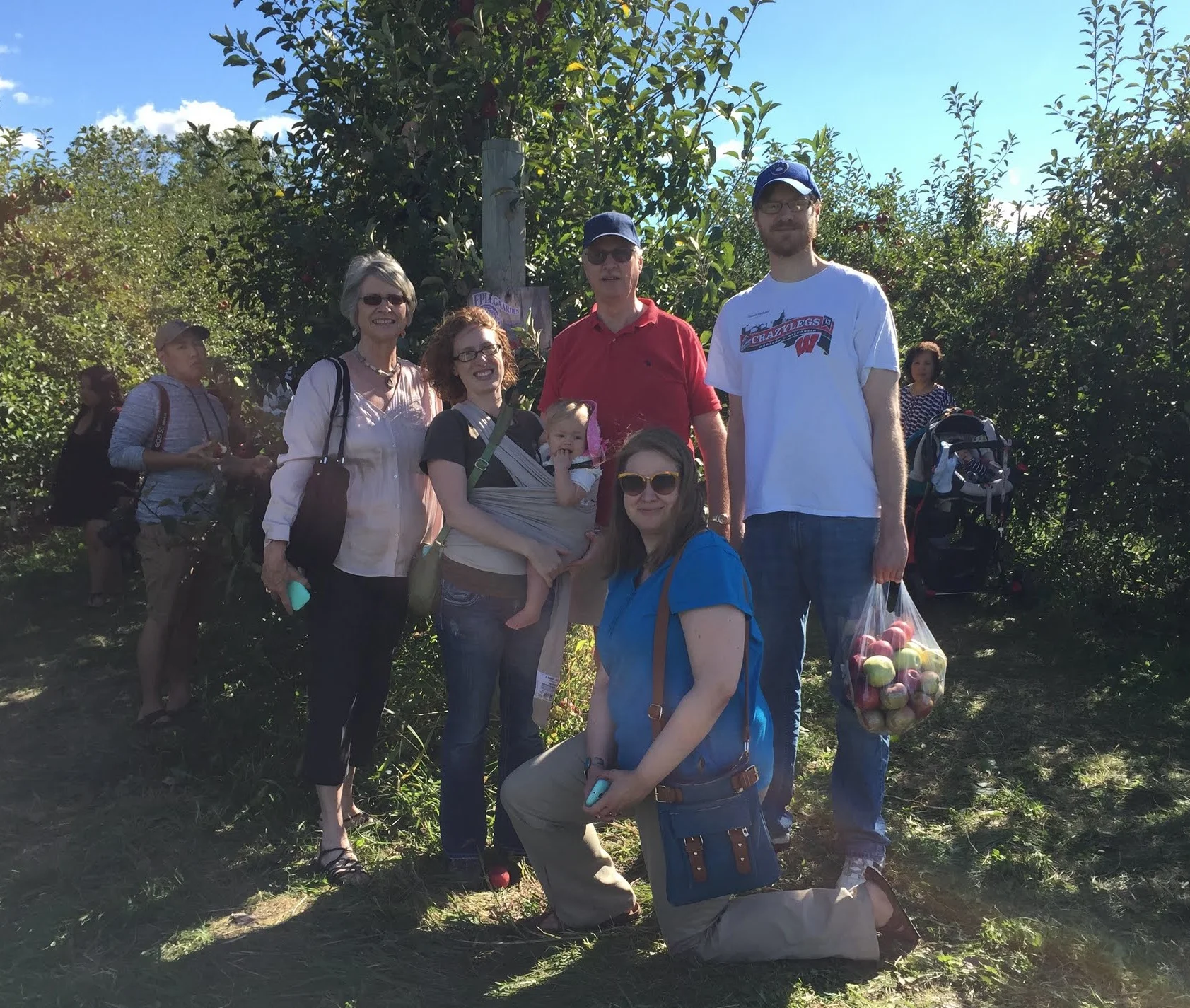 john’s family at the apple orchard
