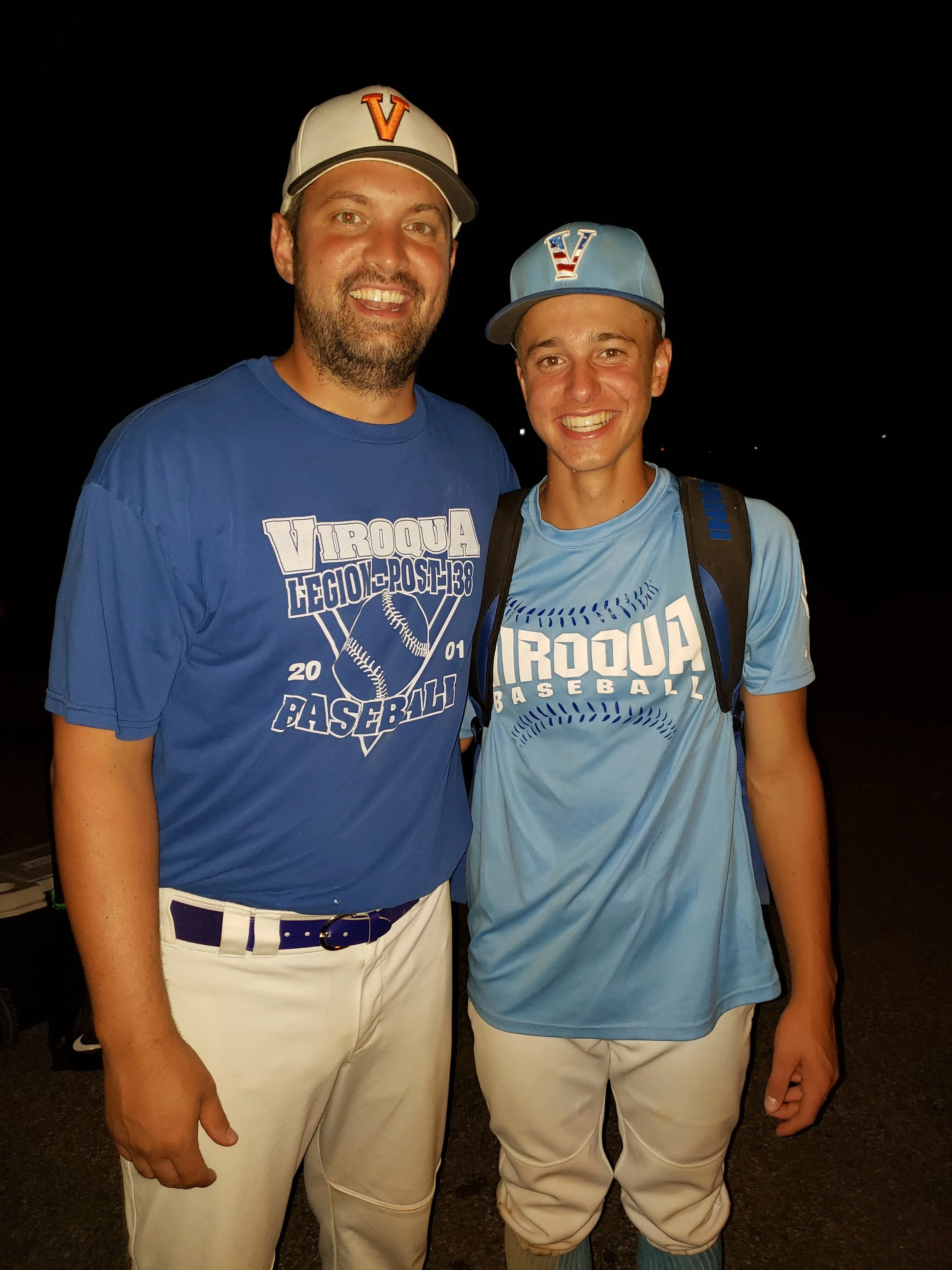 tim and his nephew playing together in an alumni baseball tournament