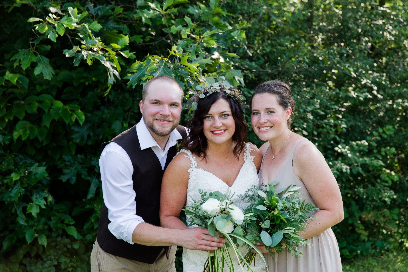 Sibling love! Sarah with her brother Craig and sister Kristi on our wedding day