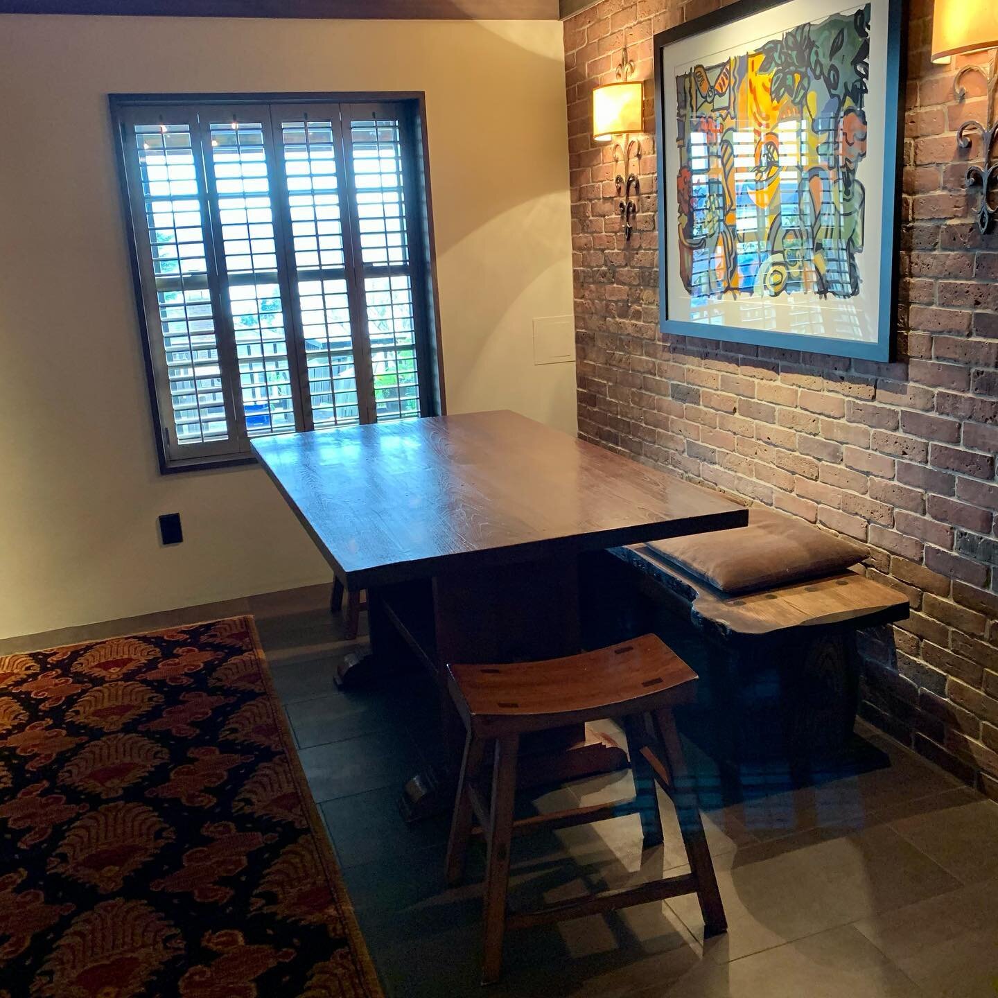 We recently completed this basement wine room. We utilized a custom made thin brick to replicate the appearance of an existing brick wall of yesteryear, a bronze glazed floor tile and installed an electric heat system under the tile which is used as 