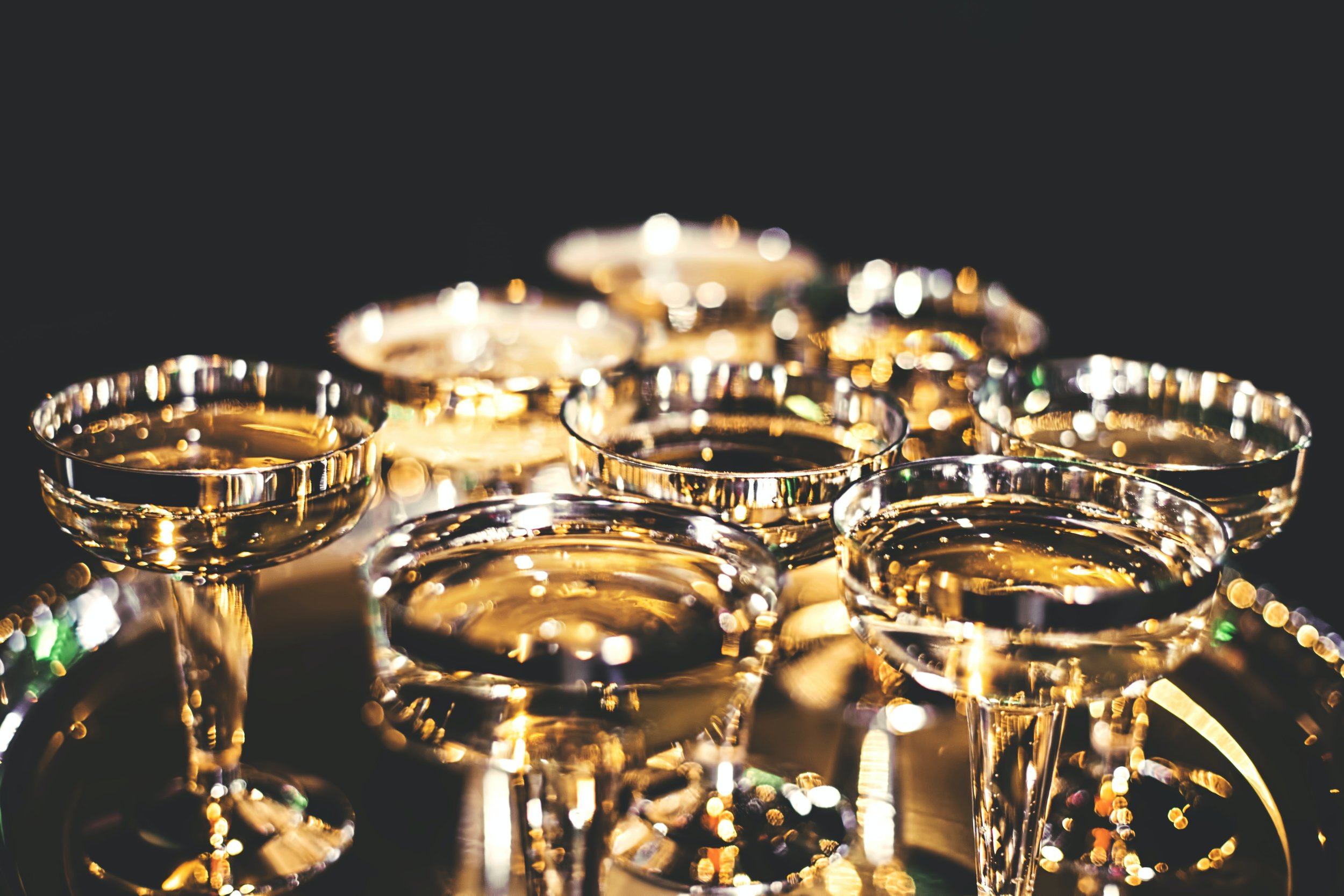 A tray of gold champagne saucers