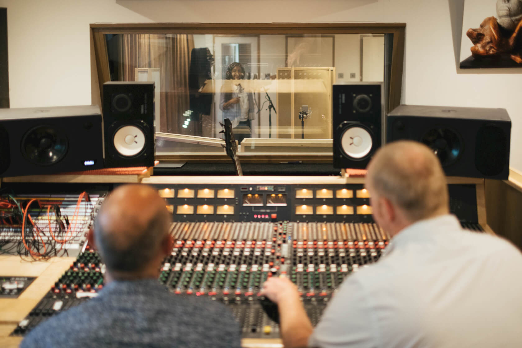 studio-control-room-producer-director-looking-at-voicereel-artist-recording-what-a-voice-©IanWallman.jpg