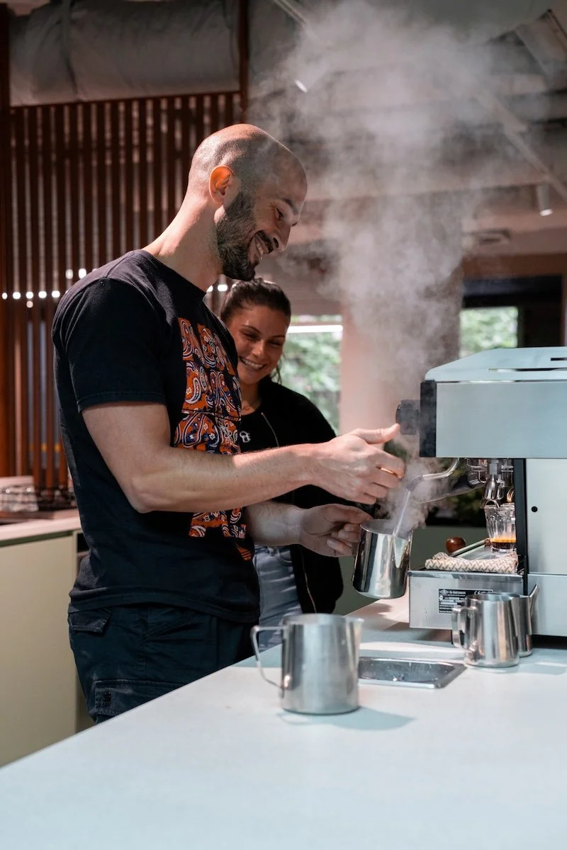 barista steaming milk during a coffee class