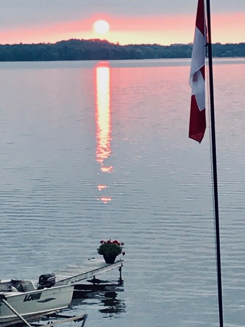 “From our home on the west shore of Cameron Lake, twice a year, coinciding with the equinox, the sun rises directly from the mound in the background.” - Bruce Forrester & Diana Wood