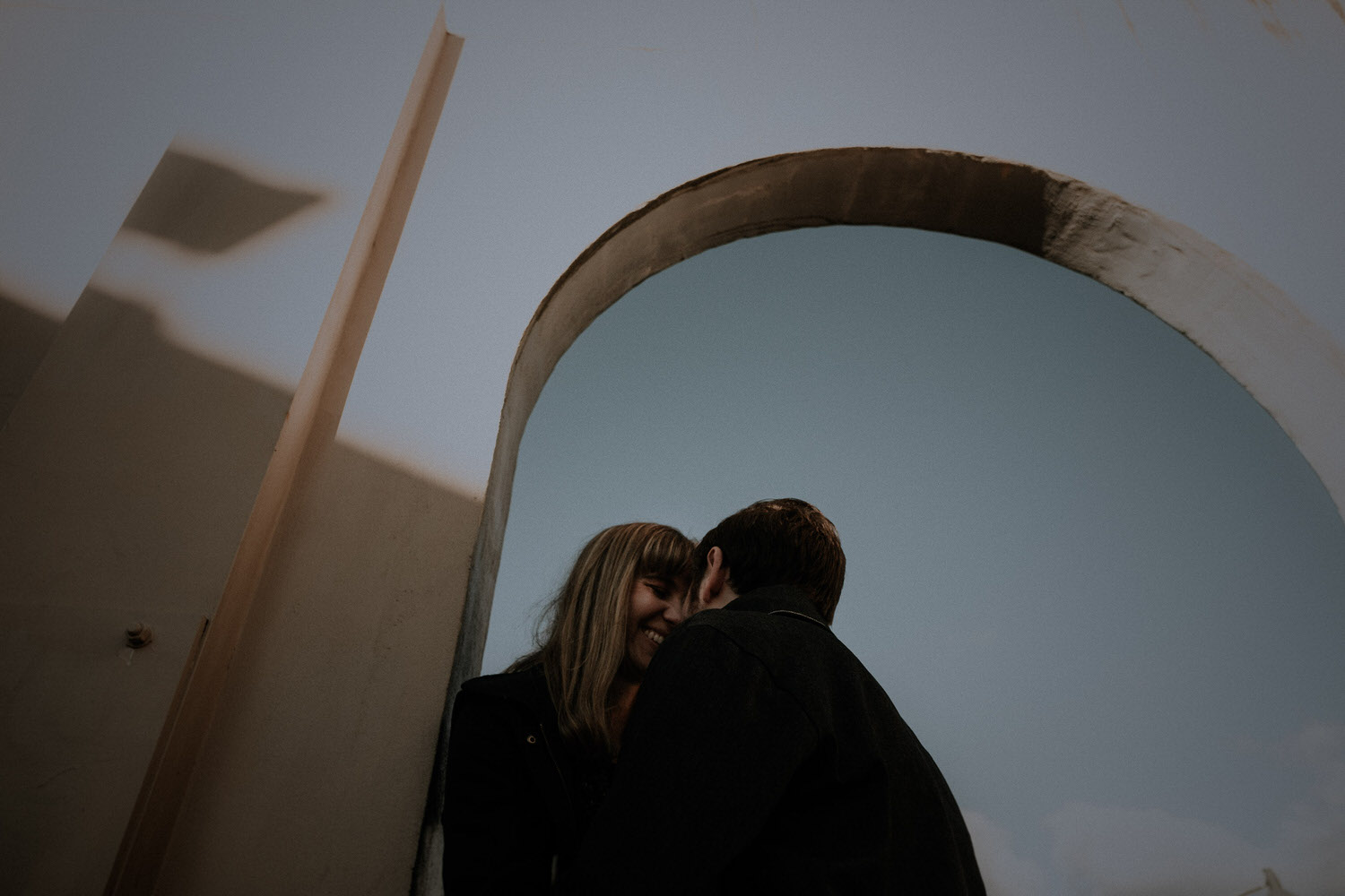 A couple take creative engagement photos before their wedding in the Blue Mountains